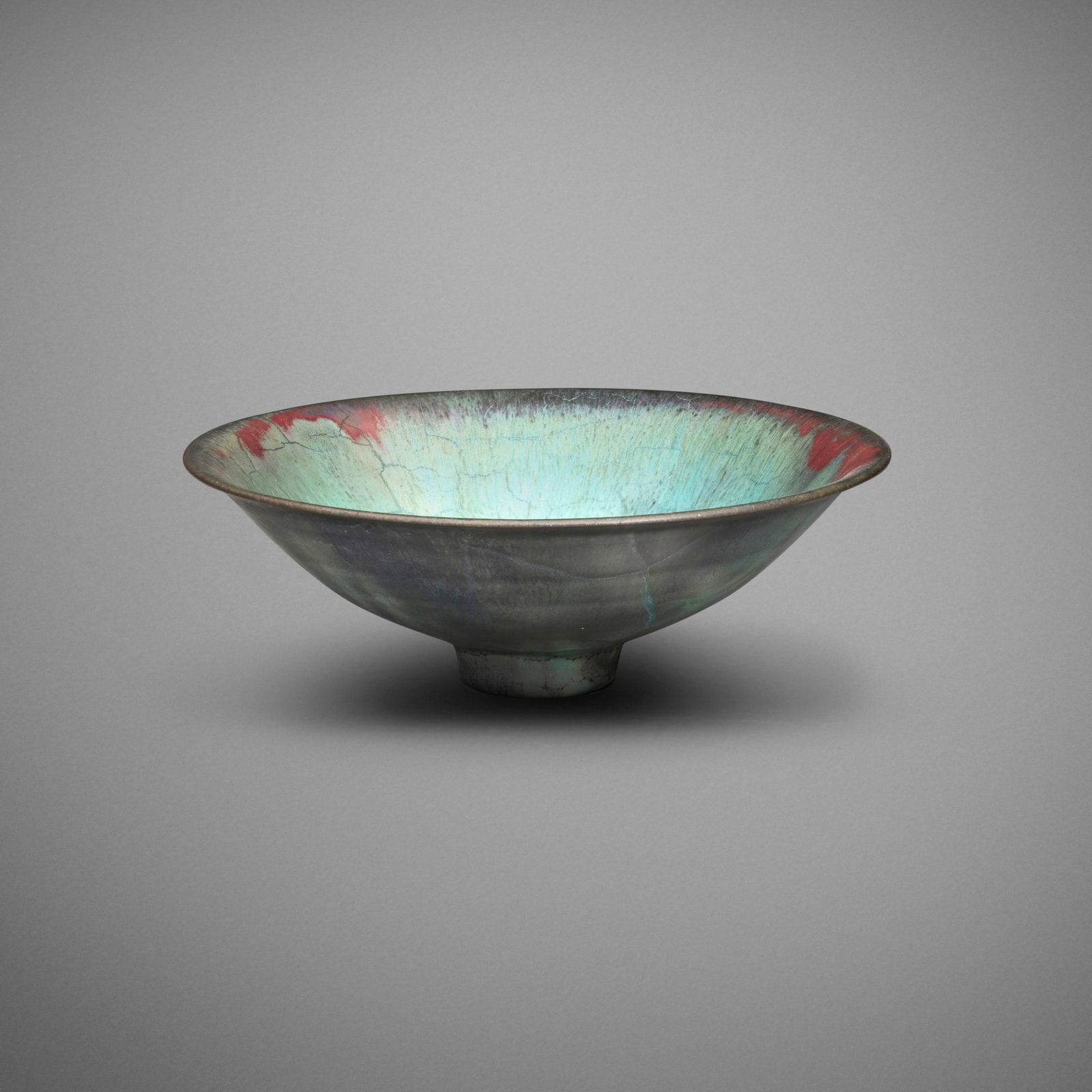 Gertrud and Otto Natzler, Flaring bowl: Gertrud and Otto Natzler Flaring bowl 1965 earthenware with Blue Green and Sang Reduction Fired glaze and melt fissures 2.125 h x 6.375 dia in (5 x 16 cm) Signed to underside 'Natzler' with archive
