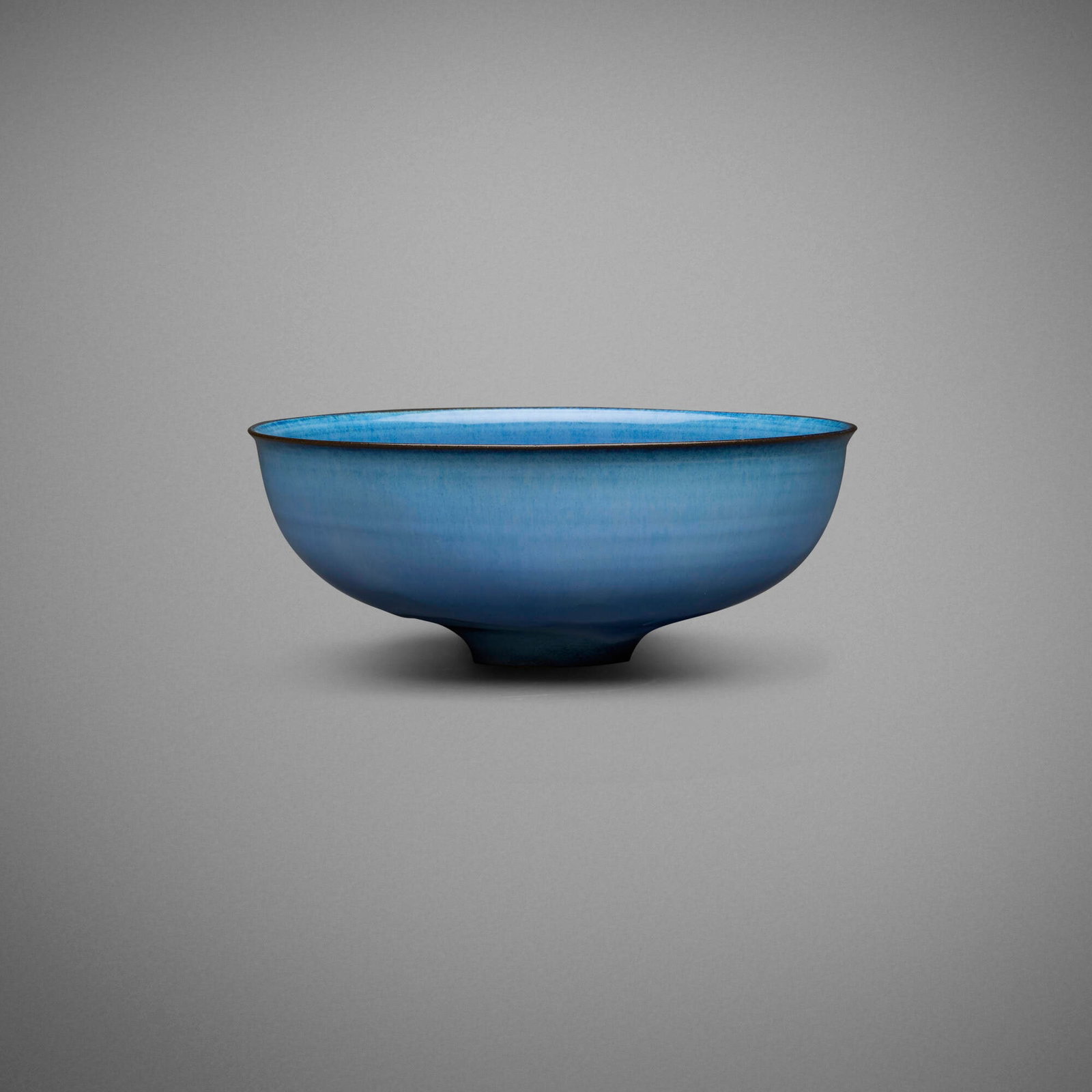 Gertrud and Otto Natzler, Bowl with lip and fingermarks: Gertrud and Otto Natzler Bowl with lip and fingermarks 1963 earthenware with Azure glaze 2.75 h x 7.125 dia in (7 x 18 cm) Signed to underside 'Natzler' with archive number 'M579' with red
