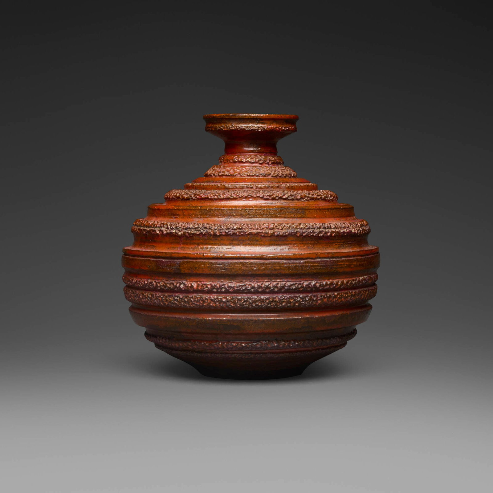 Gertrud and Otto Natzler, Massive spherical bottle: Gertrud and Otto Natzler Massive spherical bottle 1960 earthenware with Red glaze 7.125 h x 7 dia in (18 x 18 cm) Massive refers to the thick walls, rather than the size, of the present work. Signed