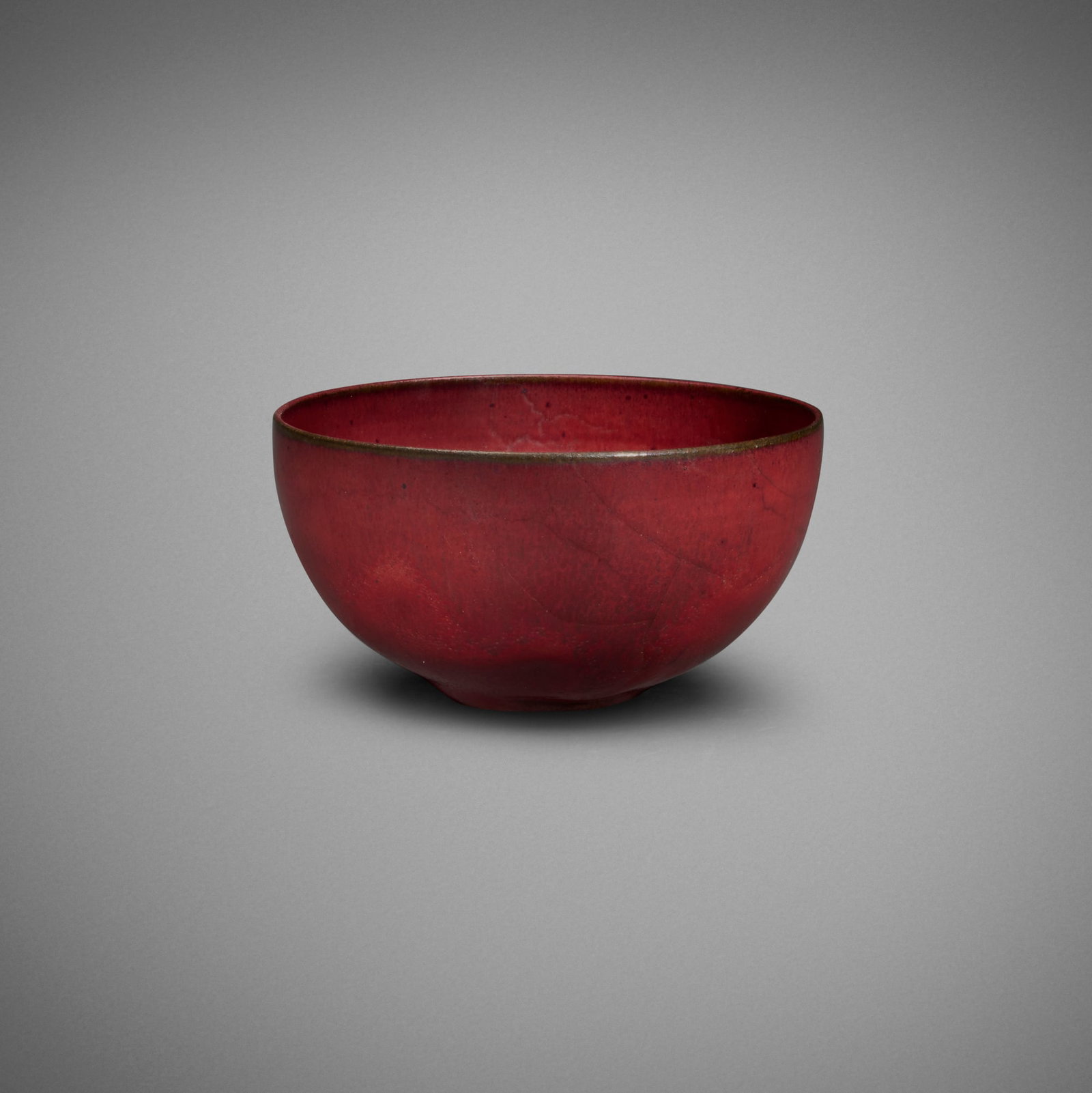 Gertrud and Otto Natzler, Bowl: Gertrud and Otto Natzler Bowl 1947 earthenware with Sang Reduction Fired glaze with melt fissures 2.375 h x 4.375 dia in (6 x 11 cm) Signed to underside 'Natzler' with archive number