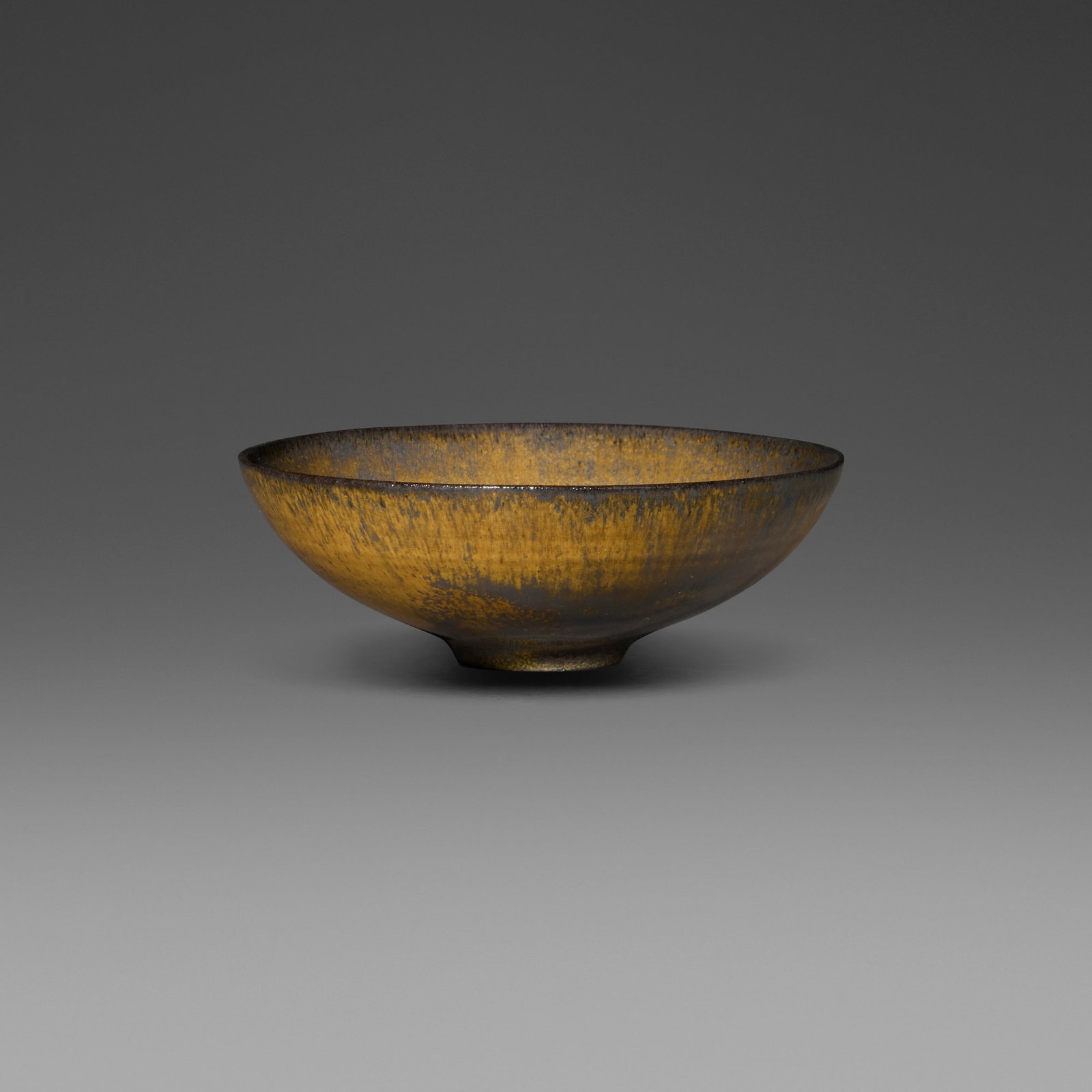 Gertrud and Otto Natzler, Bowl: Gertrud and Otto Natzler Bowl 1961 earthenware with Tiger Eye Reduction Fired glaze 1.75 h x 4.75 dia in (4 x 12 cm) Signed to underside 'Natzler' with archive number 'L605'. This wor