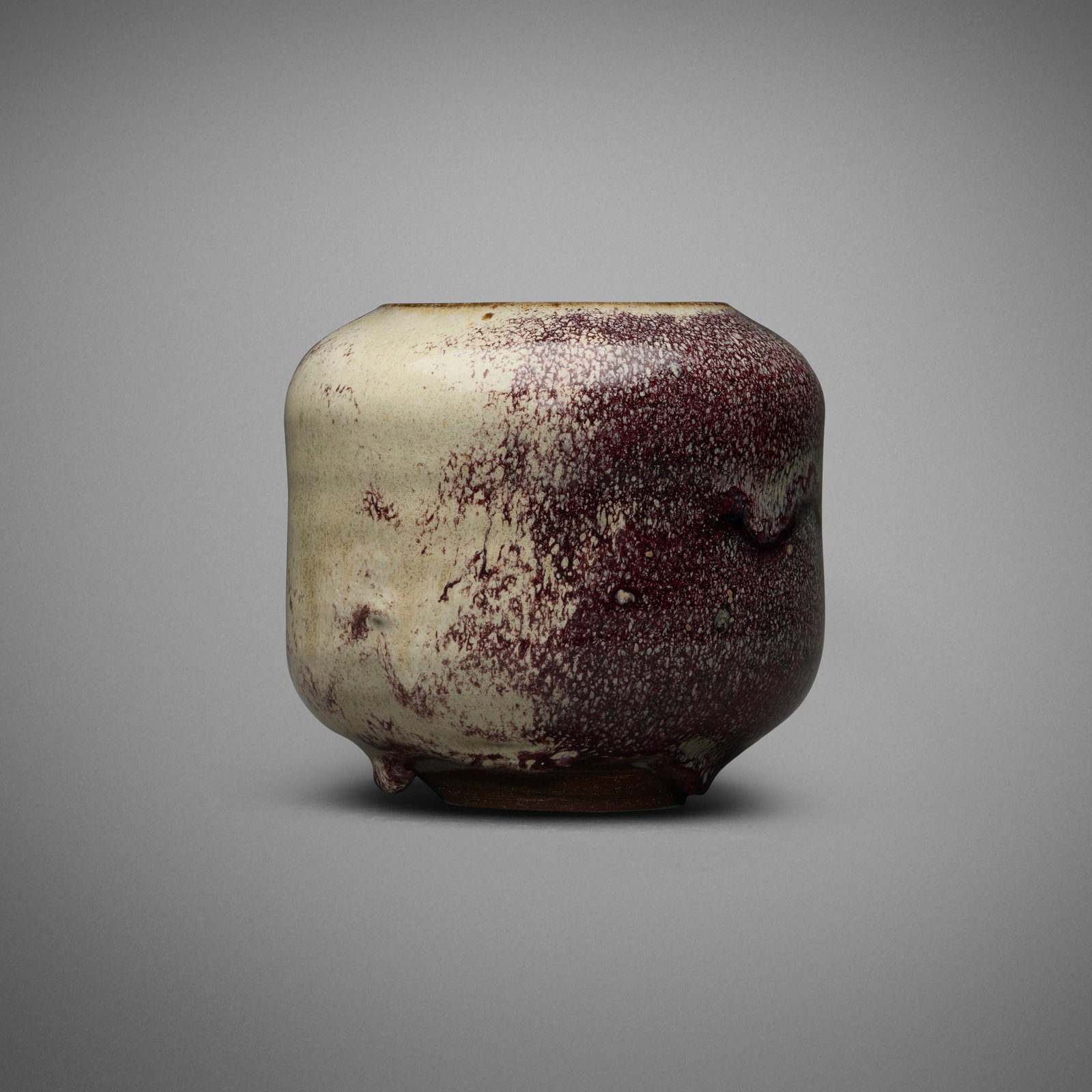 Gertrud and Otto Natzler, Cylindrical vase form: Gertrud and Otto Natzler Cylindrical vase form 1968 earthenware with Peach Blossom Reduction Fired glaze with iridescence 4.375 h x 4.875 dia in (11 x 12 cm) Signed to underside 'Natzler' with
