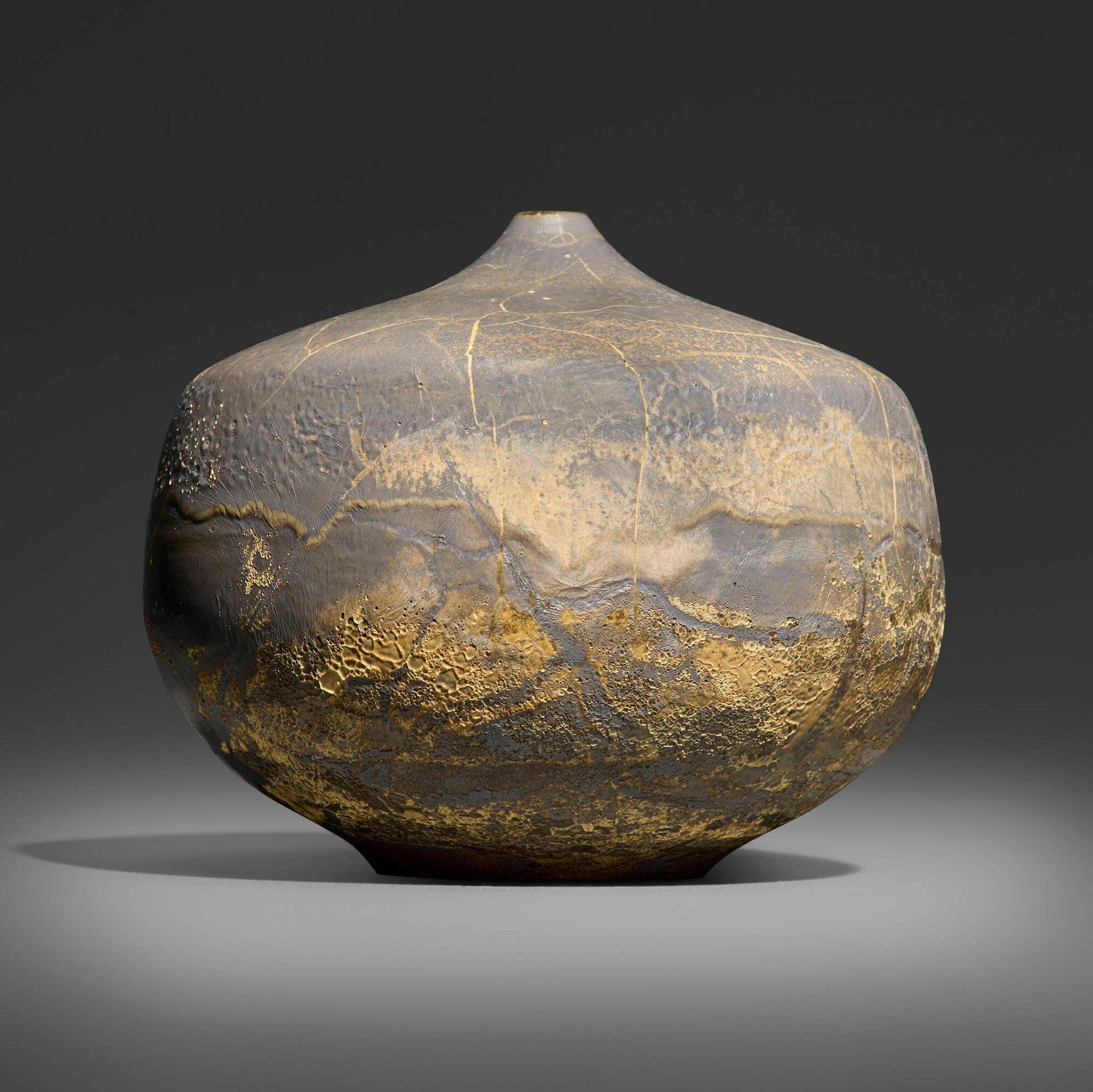 Gertrud and Otto Natzler, Closed form: Gertrud and Otto Natzler Closed form 1971 earthenware with Ivory Celadon Reduction Fired glaze with melt fissures, flame marks, skinning, and iridescence 8.25 h x 10 dia in (21 x 25 cm) Signed