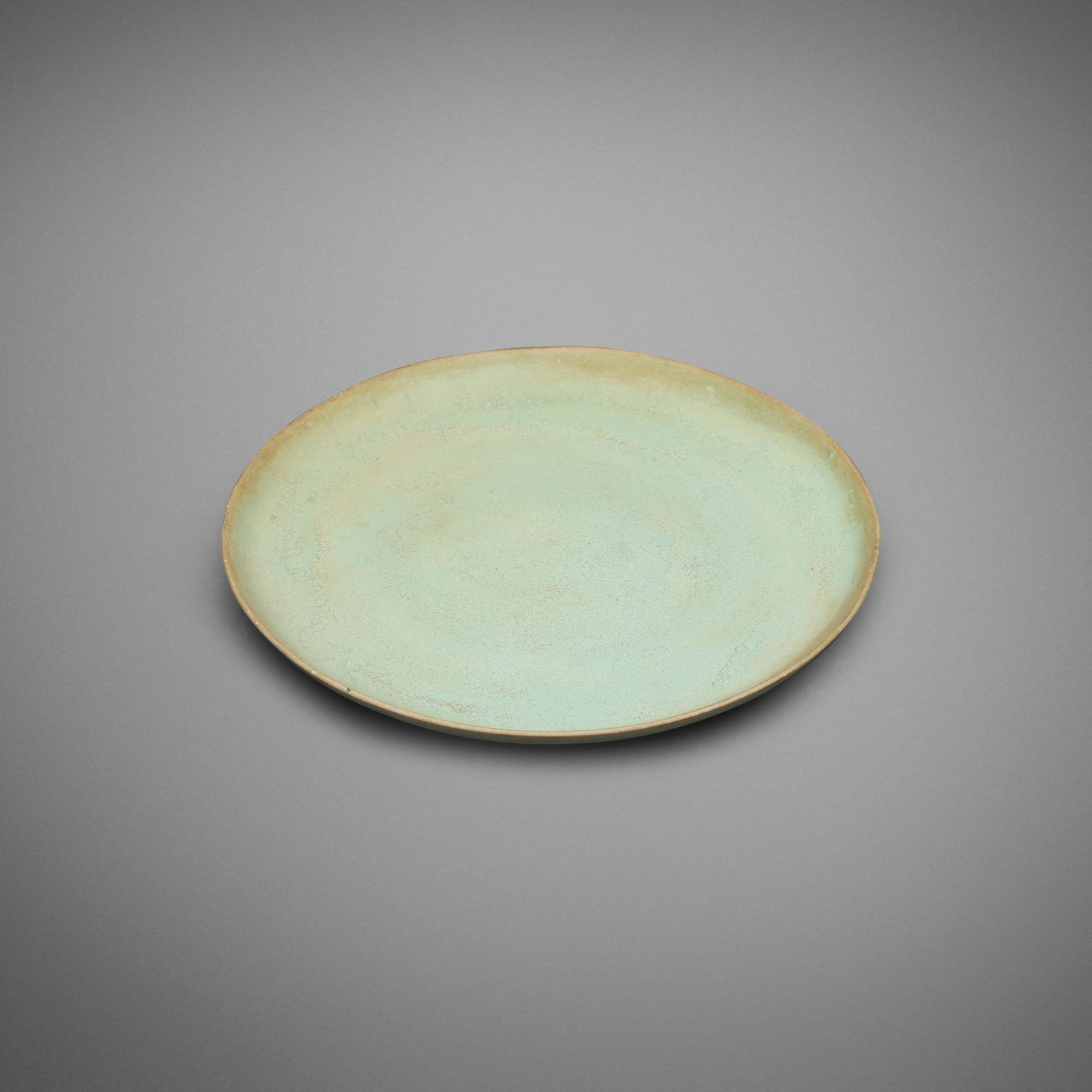 Gertrud and Otto Natzler, Plate: Gertrud and Otto Natzler Plate c. 1937 earthenware with Light Green Mat glaze 0.5 h x 6.125 dia in (1 x 16 cm) Impressed early mark to underside with archive number 'Z110'. This work