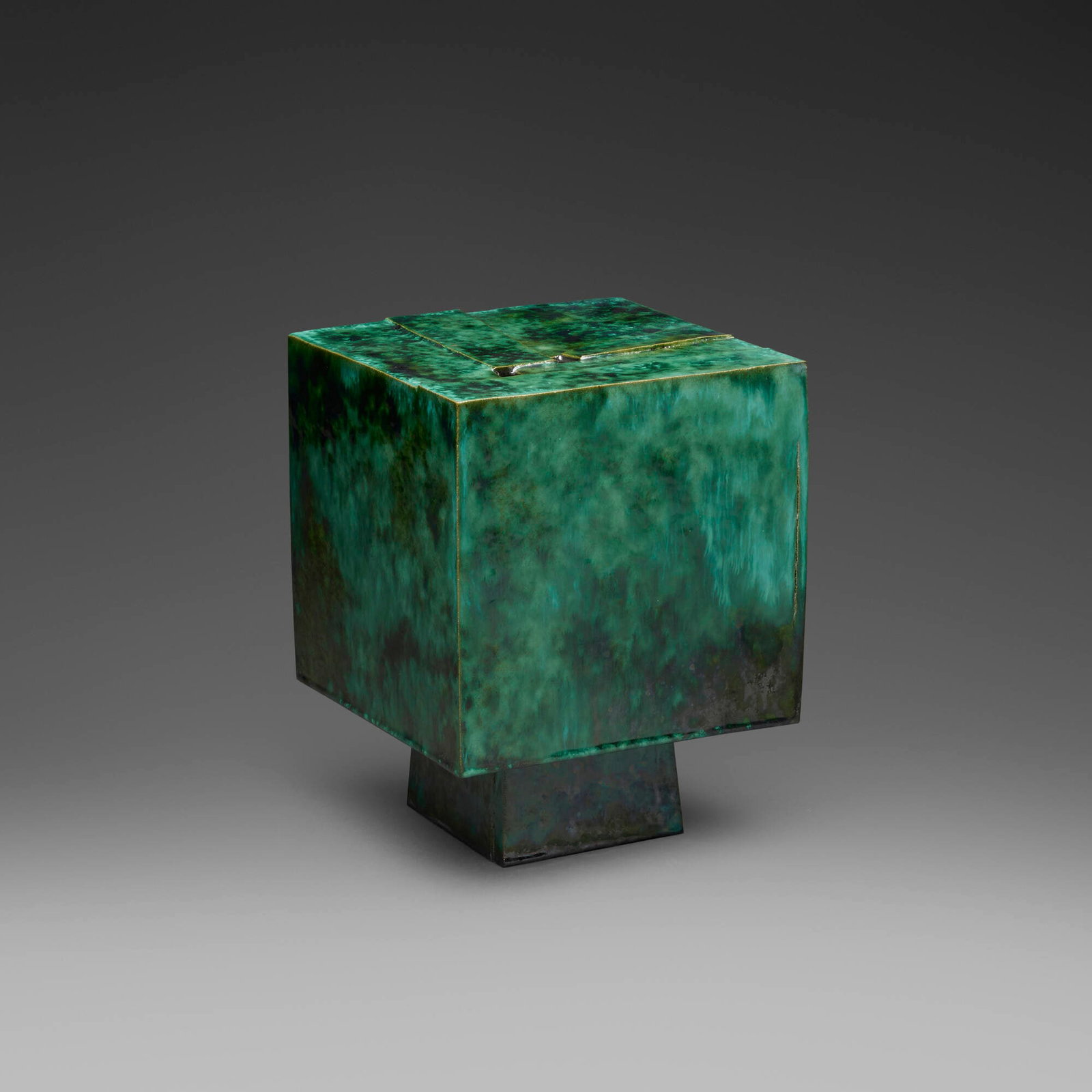 Otto Natzler, Cube with frag top, two openings: Otto Natzler Cube with frag top, two openings 1982-83 earthenware with Dark Green Crystalline glaze with iridescence 9.25 h x 7 w x 7 d in (23 x 18 x 18 cm) Signed and dated to underside 'Otto