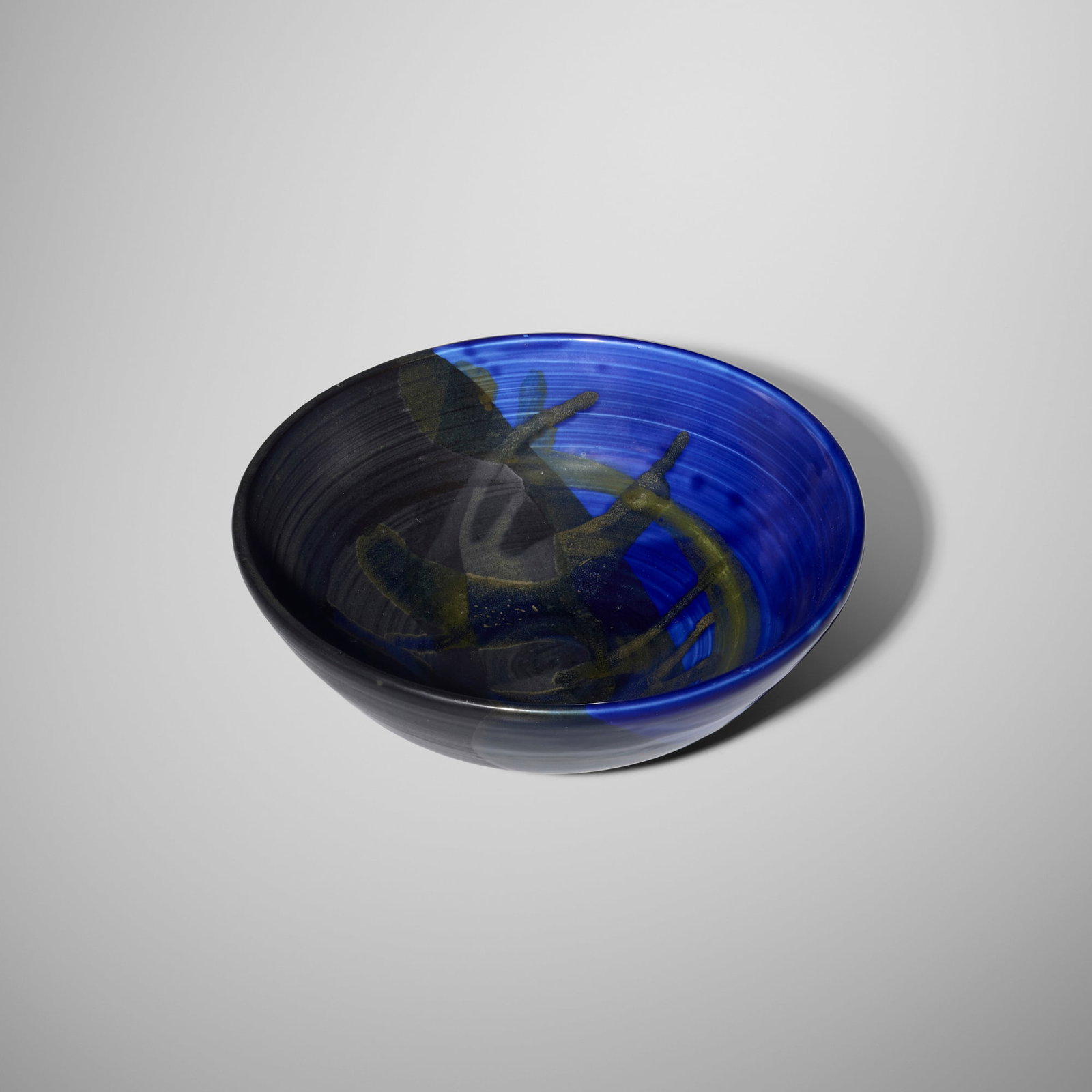 Toshiko Takaezu, Bowl: Toshiko Takaezu Bowl c. 2000 Glass Blue-glazed porcelain 3.125 h x 9.25 dia in (8 x 23 cm) Incised signature to underside 'TT'. Provenance: Acquired directly from the artist, Collection of Pearl and