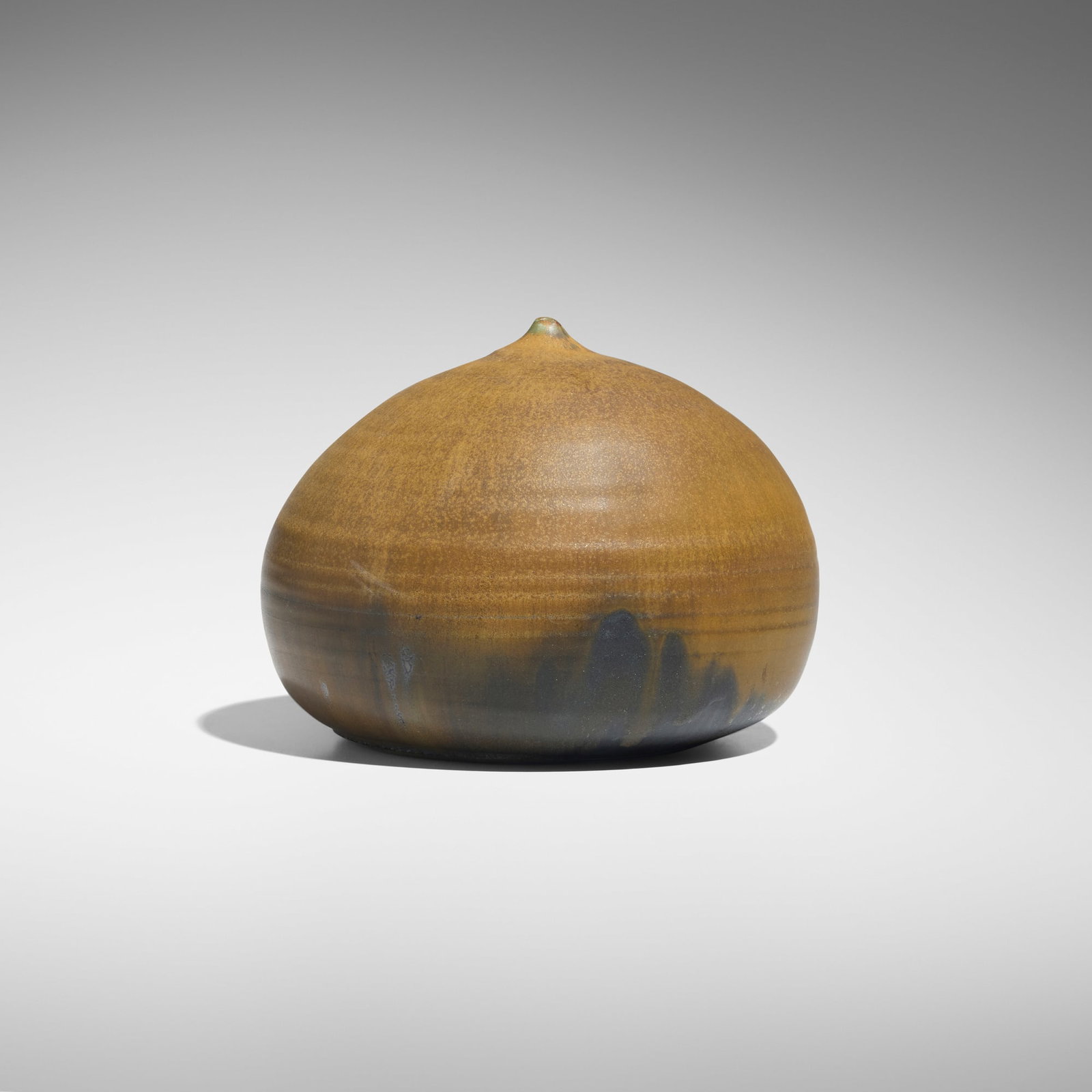 Toshiko Takaezu, Closed Form (with rattle): Toshiko Takaezu Closed Form (with rattle) c. 1980 glazed porcelain 5.25 h x 7 dia in (13 x 18 cm) Incised signature to underside 'TT'. Provenance: Private Collection, California This work will ship