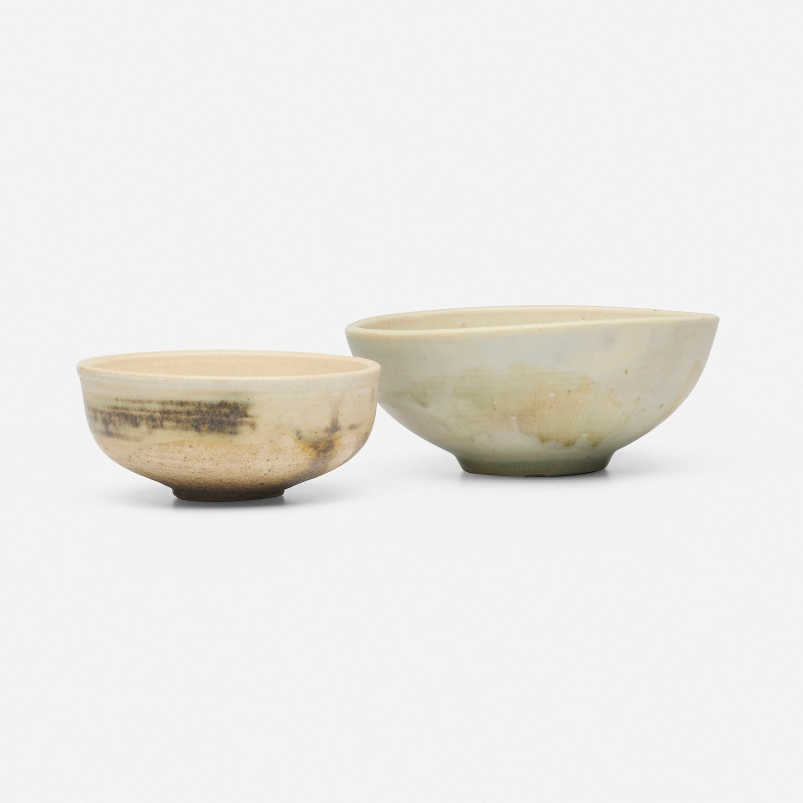 Toshiko Takaezu, Tea bowls, set of two: Toshiko Takaezu Tea bowls, set of two c. 1985 glazed porcelain 2.625 h x 6.75 w x 6.5 d in (7 x 17 x 17 cm) 2.25 h x 5.125 w x 5 d in (6 x 13 x 13 cm) Incised signature to each example 'TT'.