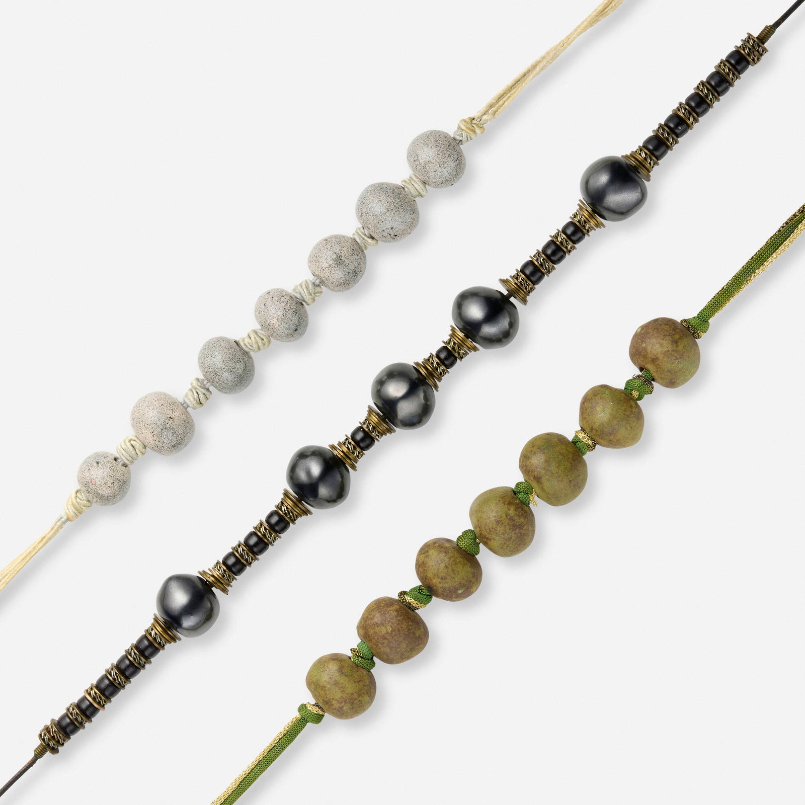 Doyle Lane, Collection of three necklaces: Doyle Lane Collection of three necklaces c. 1978-2000 leather, cloth, metal, glazed ceramic 24.125 l in (61 cm) 17.25 l in (44 cm) 17 l in (43 cm) This work will ship from Lambertville, New Jersey.