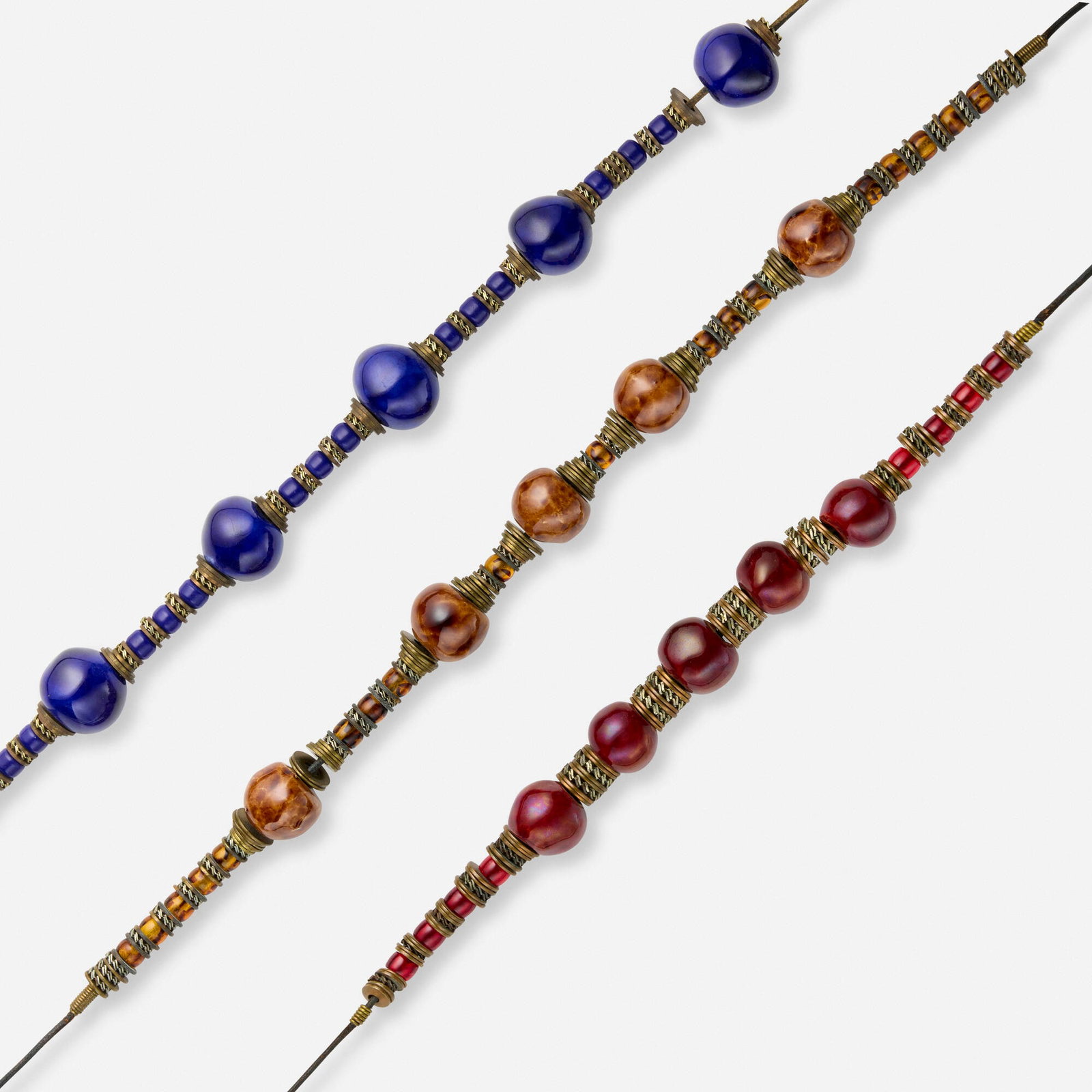 Doyle Lane, Collection of three necklaces: Doyle Lane Collection of three necklaces c. 1978-2000 leather, metal, glazed ceramic 25.5 l in (65 cm) 23.25 l in (59 cm) 19 l in (48 cm) This work will ship from Lambertville, New Jersey.