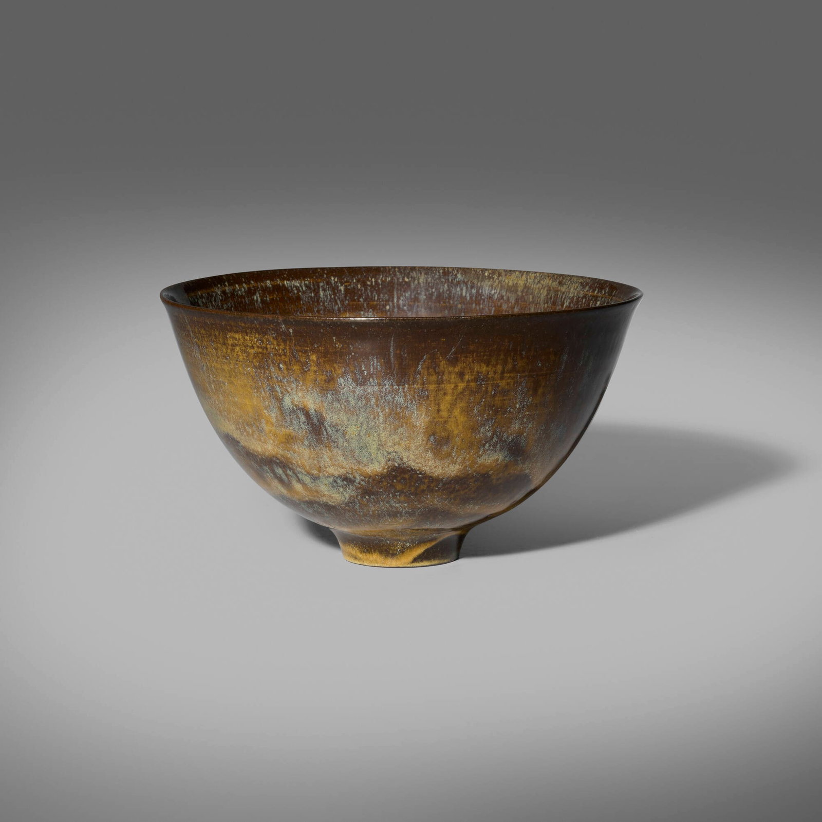 Gertrud and Otto Natzler, Bowl: Gertrud and Otto Natzler Bowl 1960 earthenware with Dark Tiger Eye Reduction Fired glaze 4.5 h x 7.75 dia in (11 x 20 cm) Signed to underside 'Natzler' with archive number 'K905'. This work