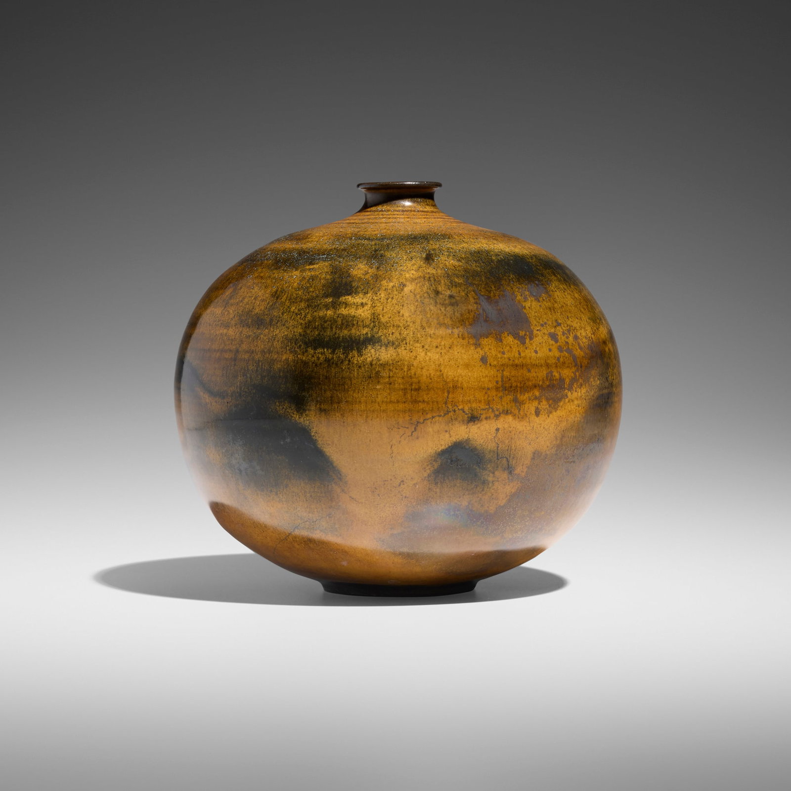 Gertrud and Otto Natzler, Spherical bottle: Gertrud and Otto Natzler Spherical bottle earthenware with Dark Tiger Eye Reduction Fired glaze 6.5 h x 7.375 dia in (17 x 19 cm) Signed to underside 'Natzler'. Provenance: Van Diemen-Lilienfield