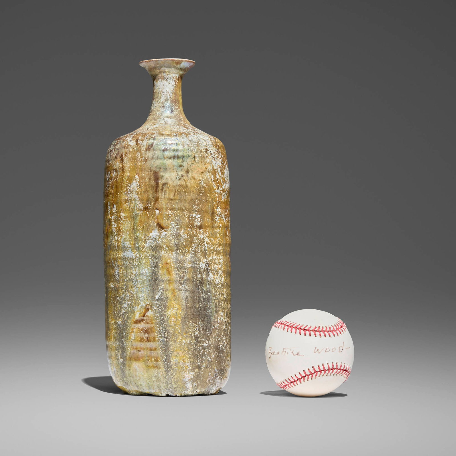 Beatrice Wood, Vase and artist-signed baseball: Beatrice Wood Vase and artist-signed baseball c. 1980 lustre-glazed earthenware, baseball vessel: 11.125 h x 4.25 w in (28 x 11 cm) baseball: 3 h x 3 dia in (8 x 8 cm) Signed to underside of vessel