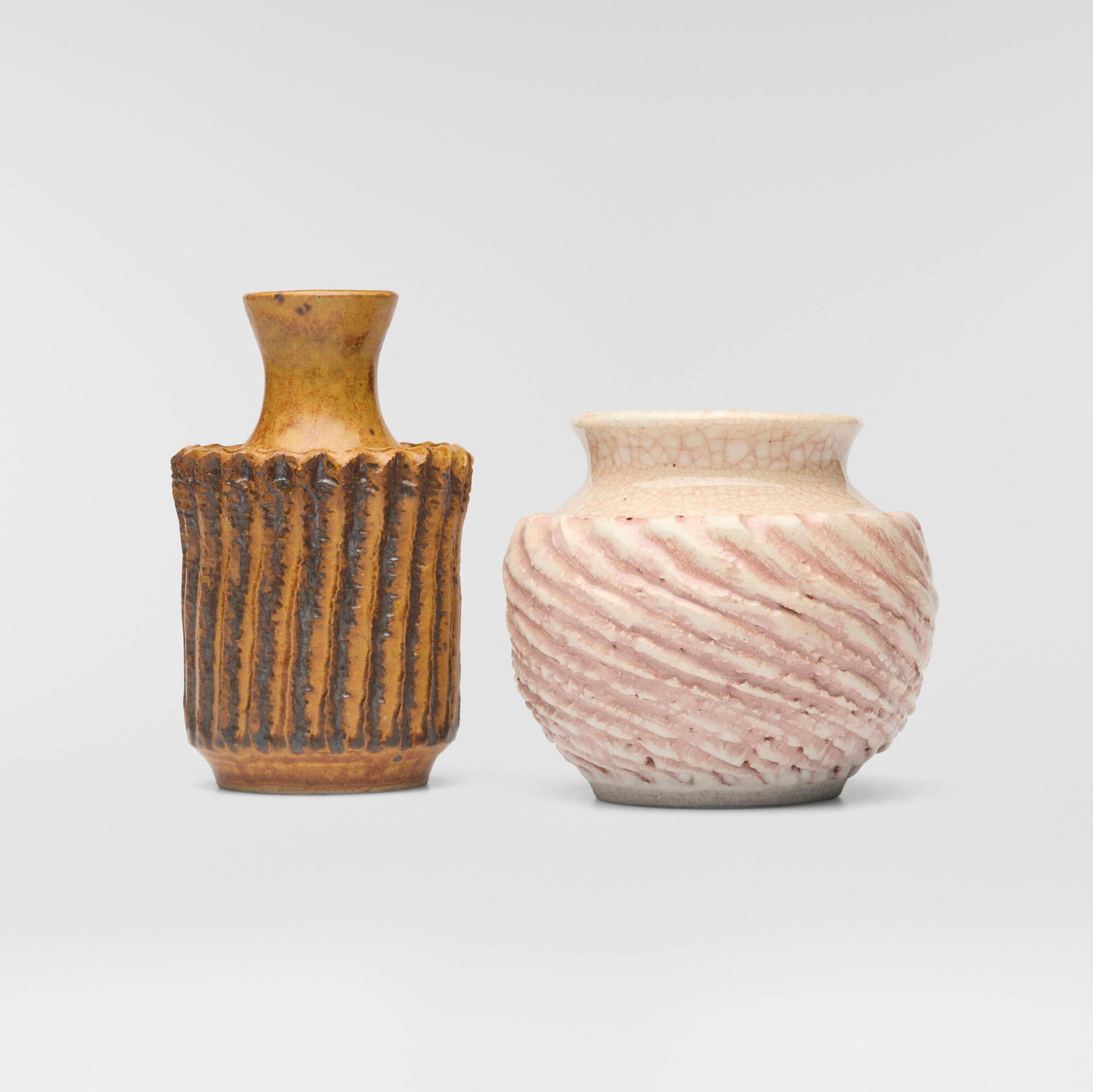 F. Carlton Ball, Vases, set of two: F. Carlton Ball Vases, set of two c. 1955 glazed stoneware with carved decoration 5.5 h x 3.375 dia in (14 x 9 cm) 4.125 h x 4.75 dia in (10 x 12 cm) Glazed signature to underside of each example