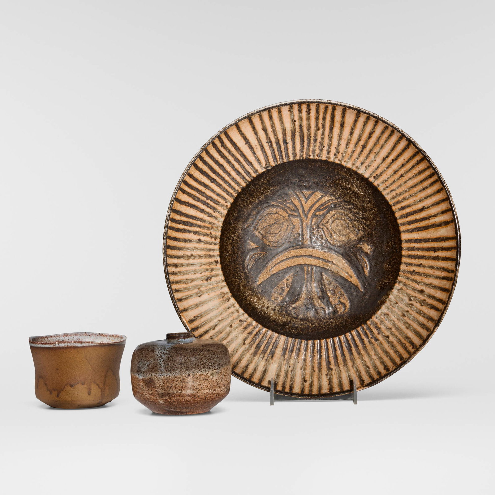 Marguerite Wildenhain, Collection of three tabletop articles: Marguerite Wildenhain Collection of three tabletop articles Pond Farm c. 1955 glazed stoneware vase: 3.375 h x 4.375 dia in (9 x 11 cm) bowl: 3 h x 4.625 dia in (8 x 12 cm) charger: 2.125 h x 13.5