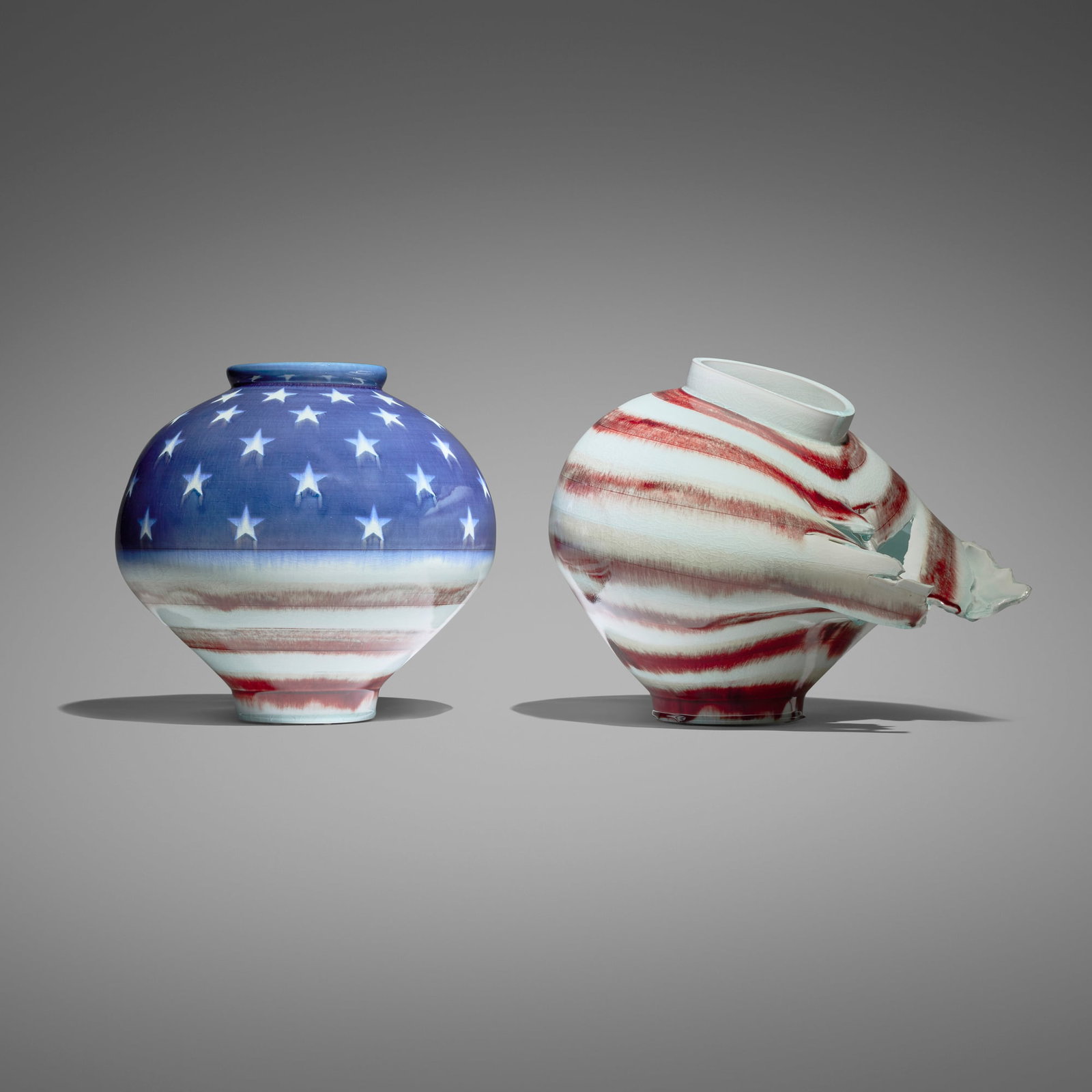 Steven Young Lee, Korean American Moon Jars from the American Flag series: Steven Young Lee Korean American Moon Jars from the American Flag series 2023 glazed porcelain diptych 13.375 h x 17 w x 15 d in (34 x 43 x 38 cm) 13 h x 13.5 dia in (33 x 34 cm) Work is composed of