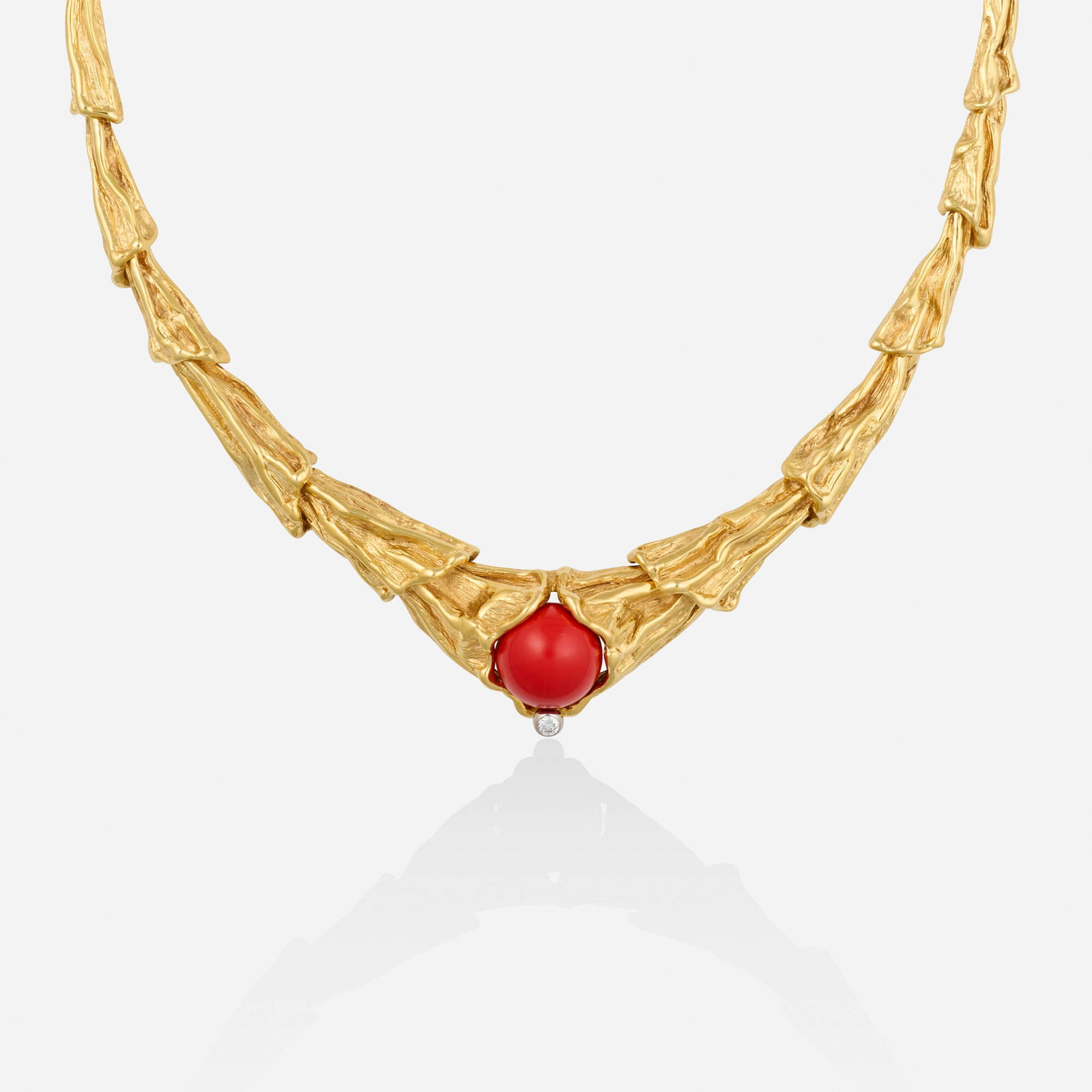 Gilbert Albert, Coral, diamond, and gold necklace: Gilbert Albert Coral, diamond, and gold necklace Lori Ulanova was one of the first female violinists in the Los Angeles Philharmonic Of freeform gold, set with a coral bead and round brilliant-cut