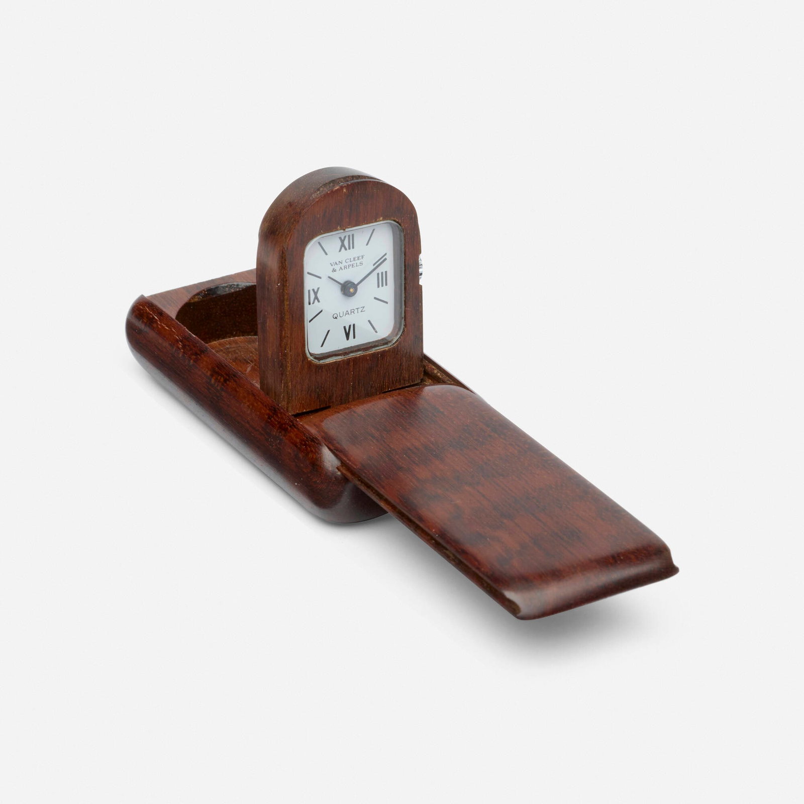 Van Cleef & Arpels, 'Domino' travel clock: Van Cleef & Arpels 'Domino' travel clock With Roman numeral and baton hours. This work is number 88 from the edition of 2001. Dial: White Movement: Quartz Case Material: Wood, steel Dimensions: 1.875