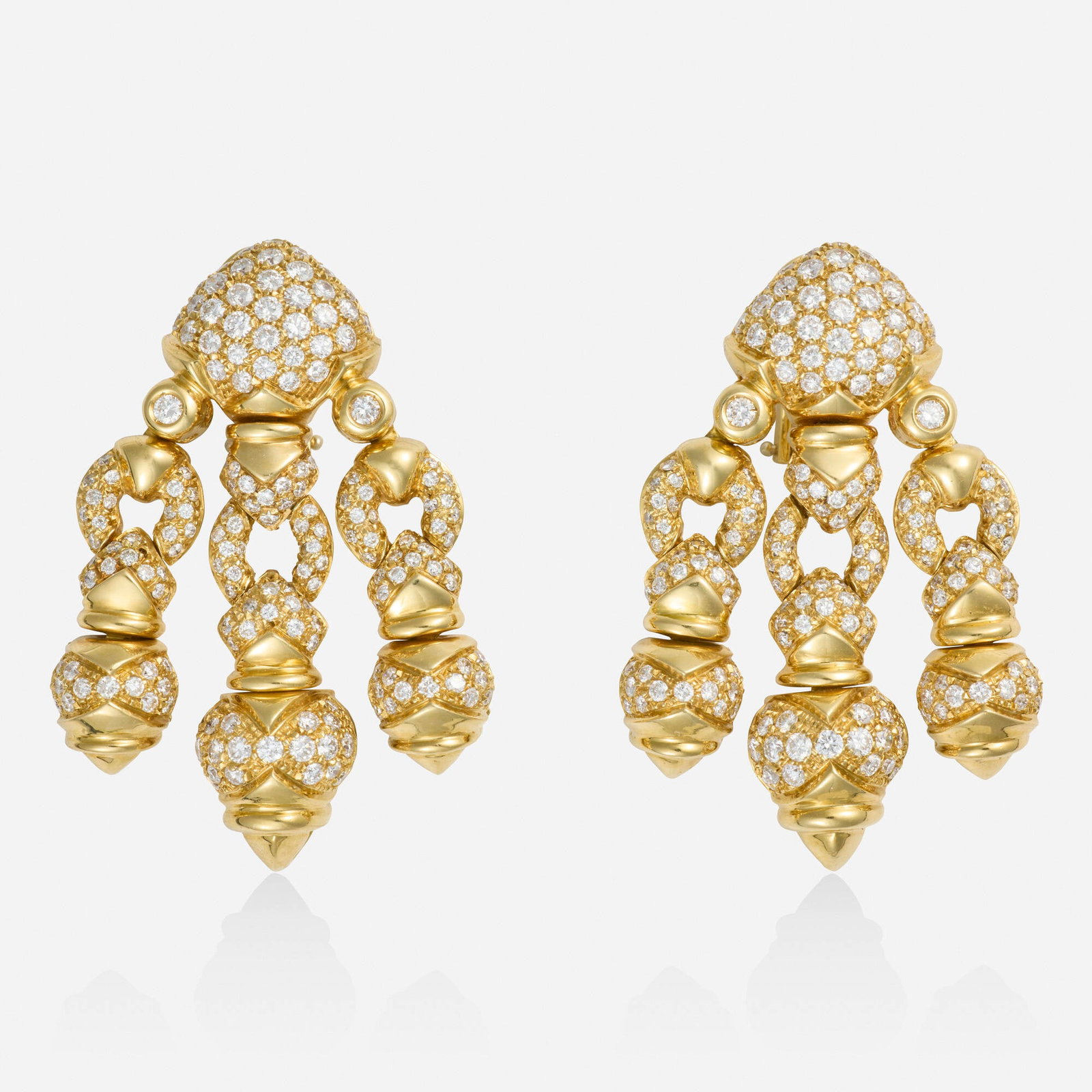 Giovane, Diamond and gold earrings: Giovane Diamond and gold earrings Of girandole design, set with round brilliant-cut diamonds 18k yellow gold Signed Giovane 1.75 x 1.125 in; Gross weight 36.6 dwts This work wi