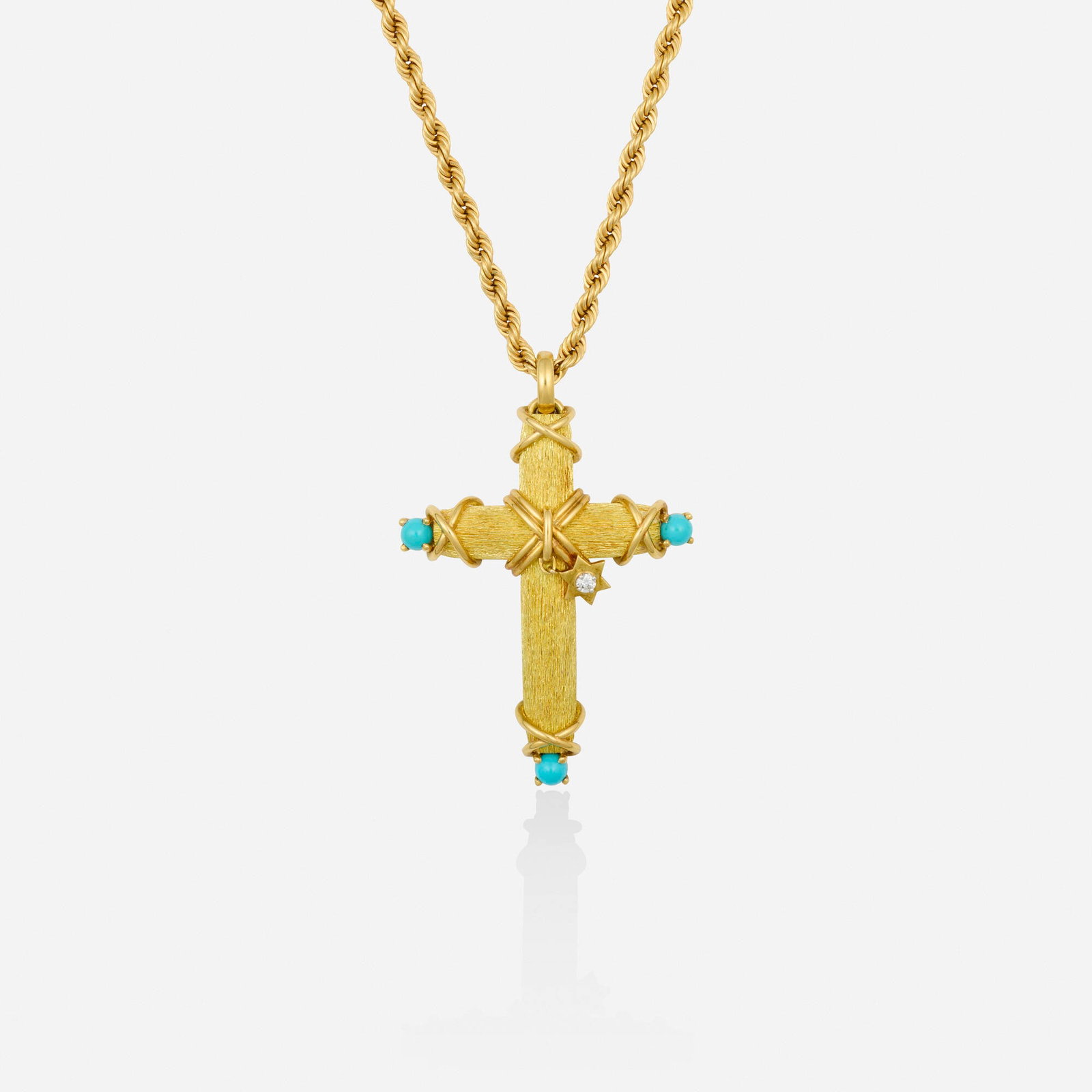 Jean Schlumberger for Tiffany & Co., Turquoise, diamond, and gold pendant and chain: Jean Schlumberger for Tiffany & Co. Turquoise, diamond, and gold pendant and chain The textured gold cross set with cabochon turquoise and a round brilliant-cut diamond star; together with a roped cha
