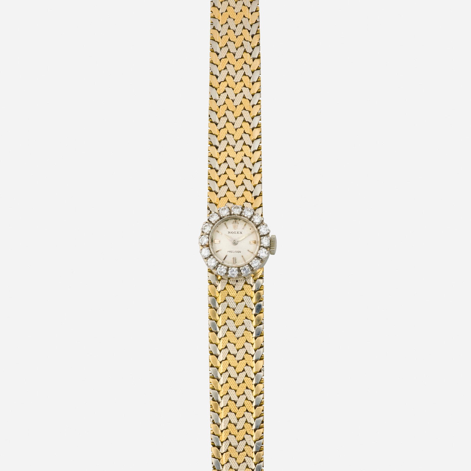 Rolex, 'Precision' diamond and bicolor gold wristwatch: Rolex 'Precision' diamond and bicolor gold wristwatch With baton hours Dial: Silvered Movement: Manual wind Case Material: White gold Case Size: 16 mm Buckle/Strap: 18k yellow and white gold, 6.25 in