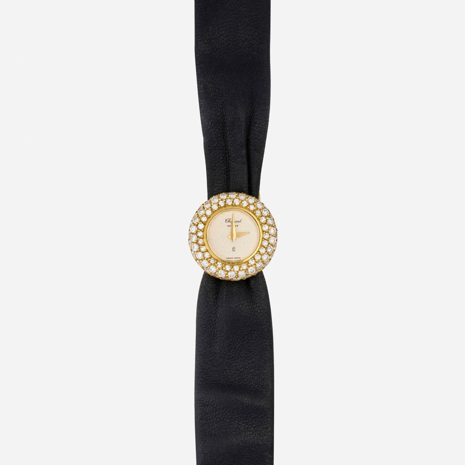 Chopard, Diamond and gold wristwatch: Chopard Diamond and gold wristwatch With sword-shaped hands Dial: Silvered Movement: Quartz Case Material: 18k yellow gold Case Size: 19 mm Buckle/Strap: Black leather strap, 6.75 in Clasp/Buckle: