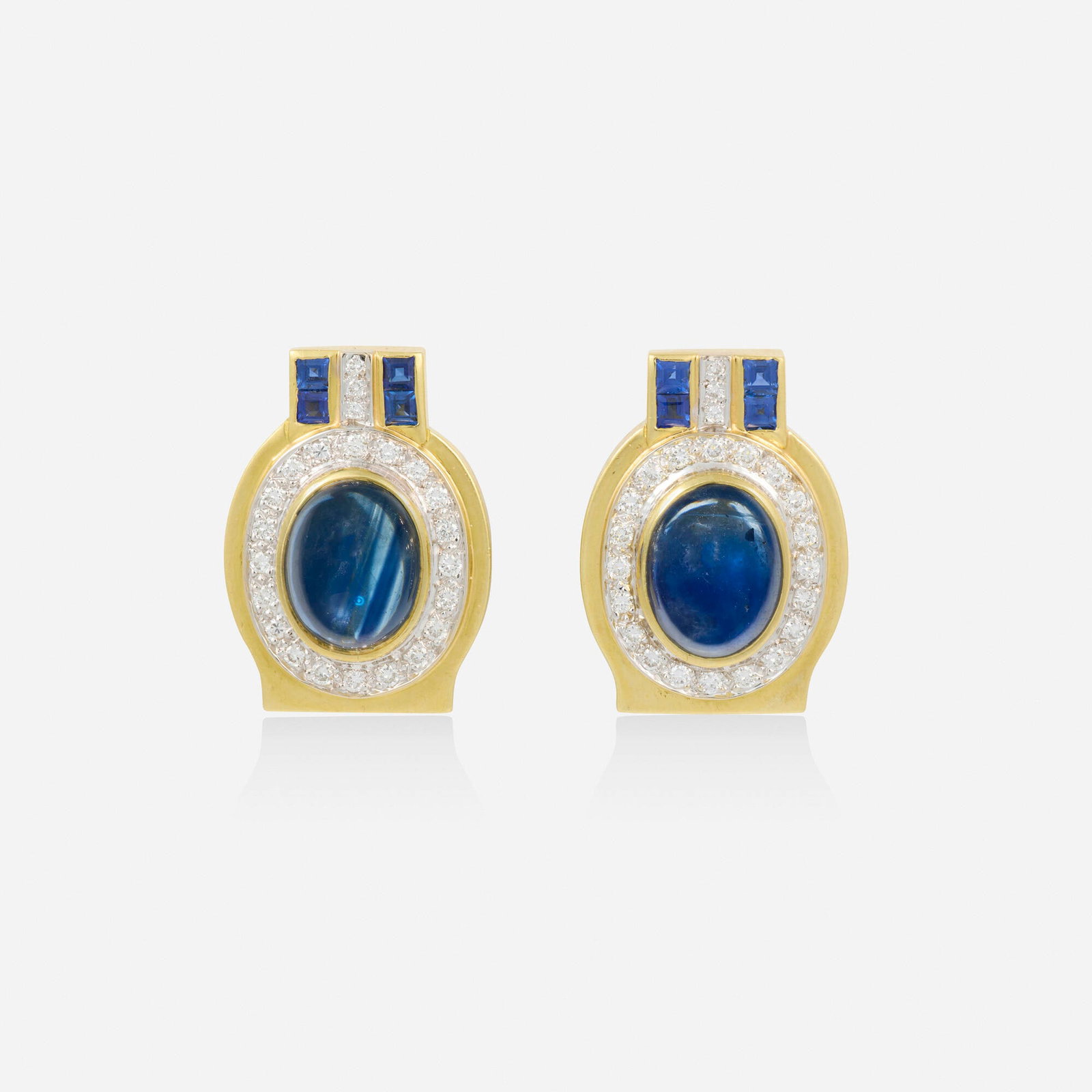 Sapphire, diamond, and gold earrings: Sapphire, diamond, and gold earrings Each set with a cabochon sapphire framed by round brilliant-cut diamonds and square-cut sapphires 18k yellow and white gold, 14k yellow gold 1 x 0.75 in; Gross