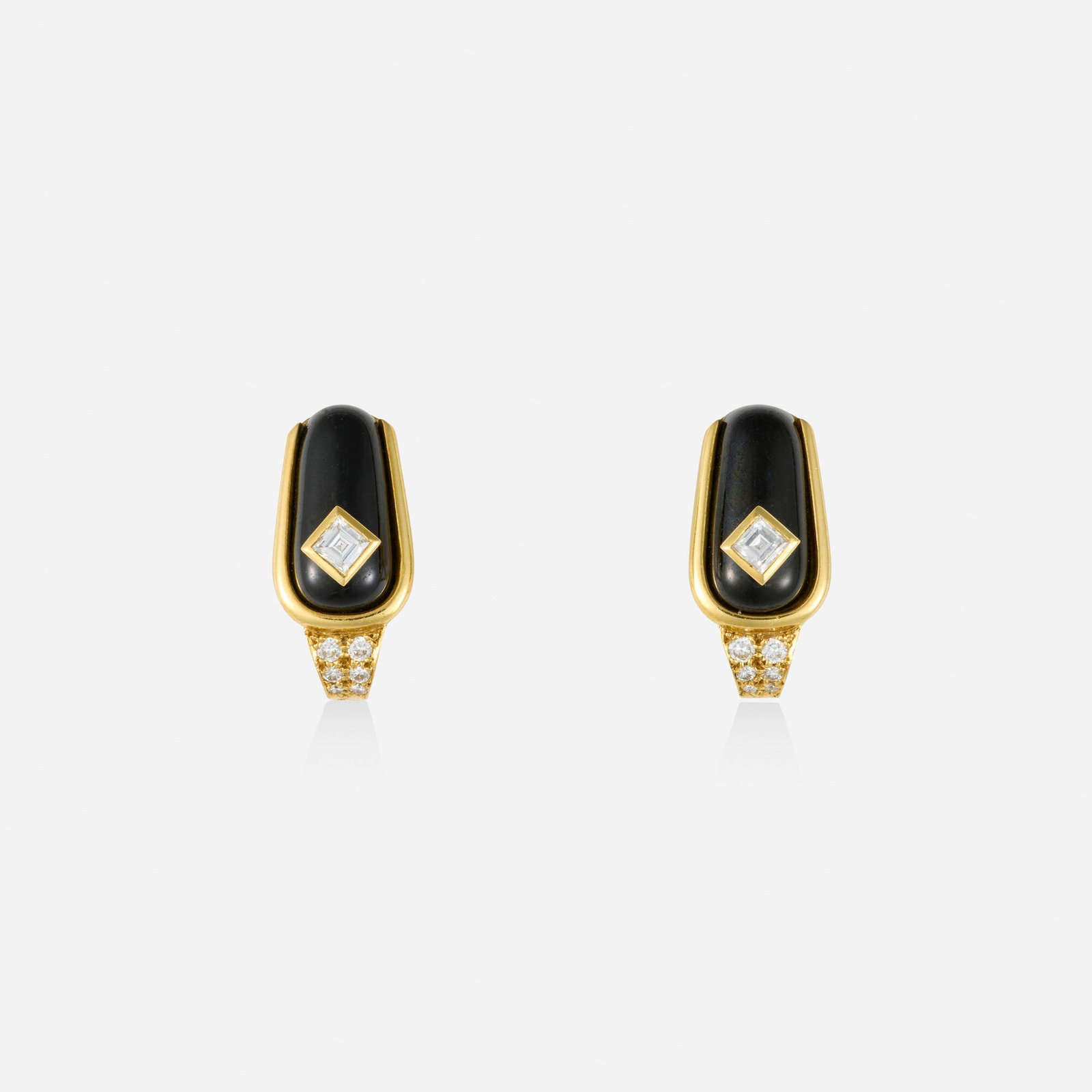 Hennell, Black onyx, diamond, and gold earrings: Hennell Black onyx, diamond, and gold earrings Each set with cabochon black onyx, square and round brilliant-cut diamonds; 1988 18k yellow gold Signed Hennell 0.75 x 0.375 in; Gross weight 7.6 dwts