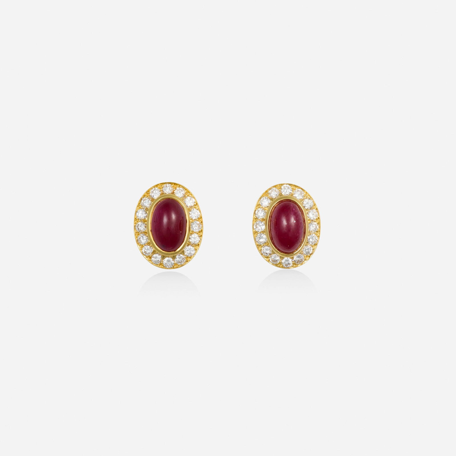 Ruby, diamond, and gold earrings: Ruby, diamond, and gold earrings Each set with a cabochon ruby framed by round brilliant-cut diamonds 18k yellow gold 0.50 x 0.375 in; Gross weight 3.2 dwts This work will ship from Lambertville, New