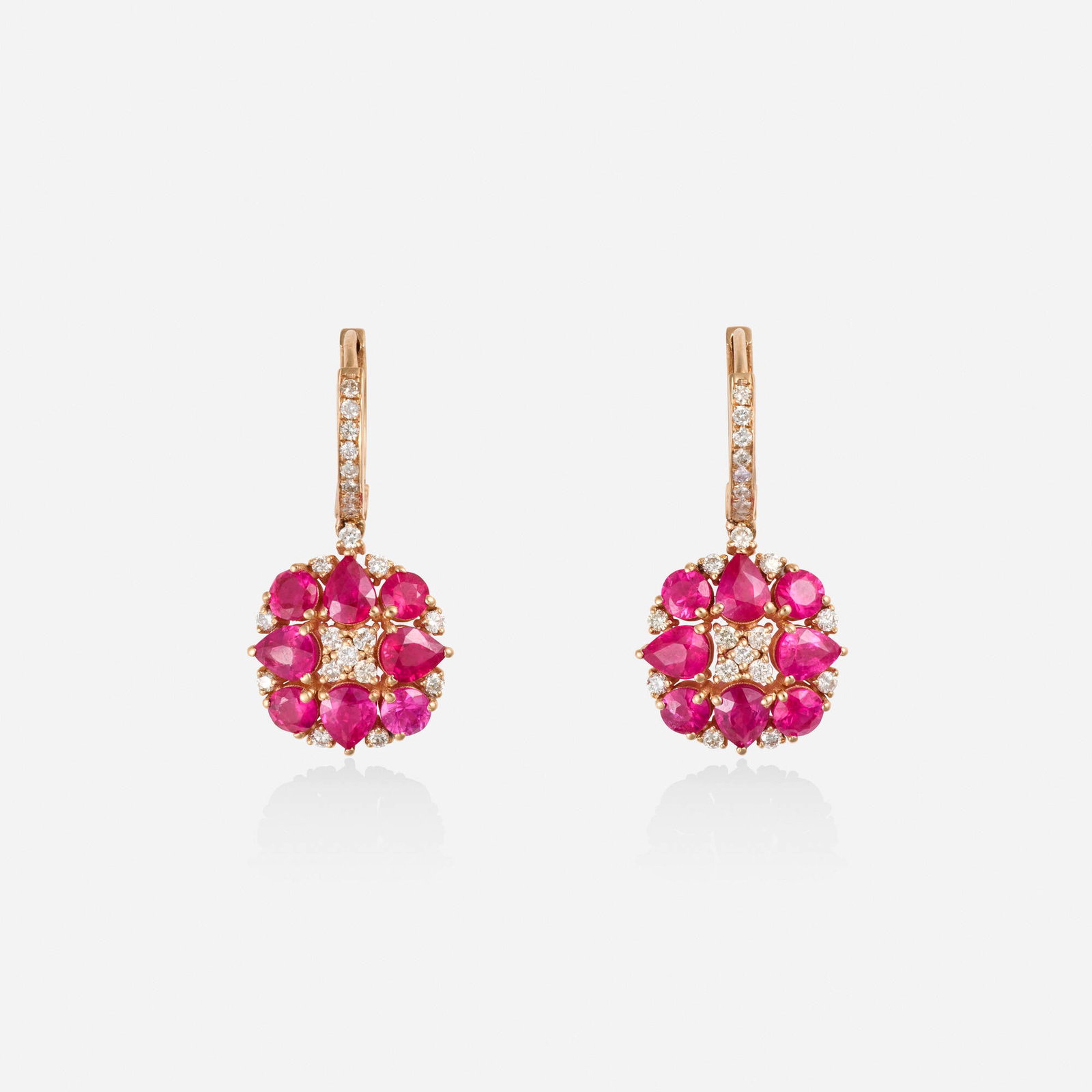 Burma ruby, diamond, pink gold earrings: Burma ruby, diamond, pink gold earrings Each set with round brilliant-cut diamonds, pear and circular-cut rubies 18k pink gold 1.1.25 x 0.50 in; Gross weight 4.6 dwts GIA Report no. 1232705451,