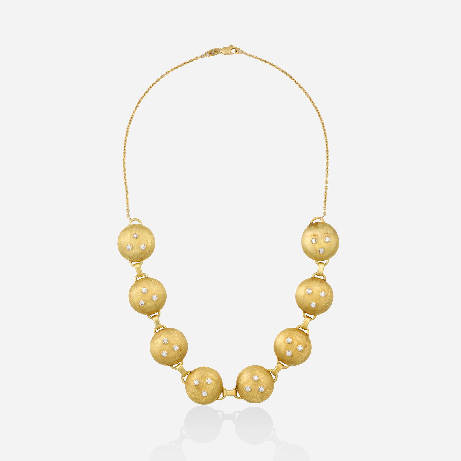Diamond and gold necklace: Diamond and gold necklace Designed with eight reeded gold links set with round brilliant-cut diamonds, joined by a fine link chain 14k yellow and white gold 15 in; Gross weight 15.0 dwts This work