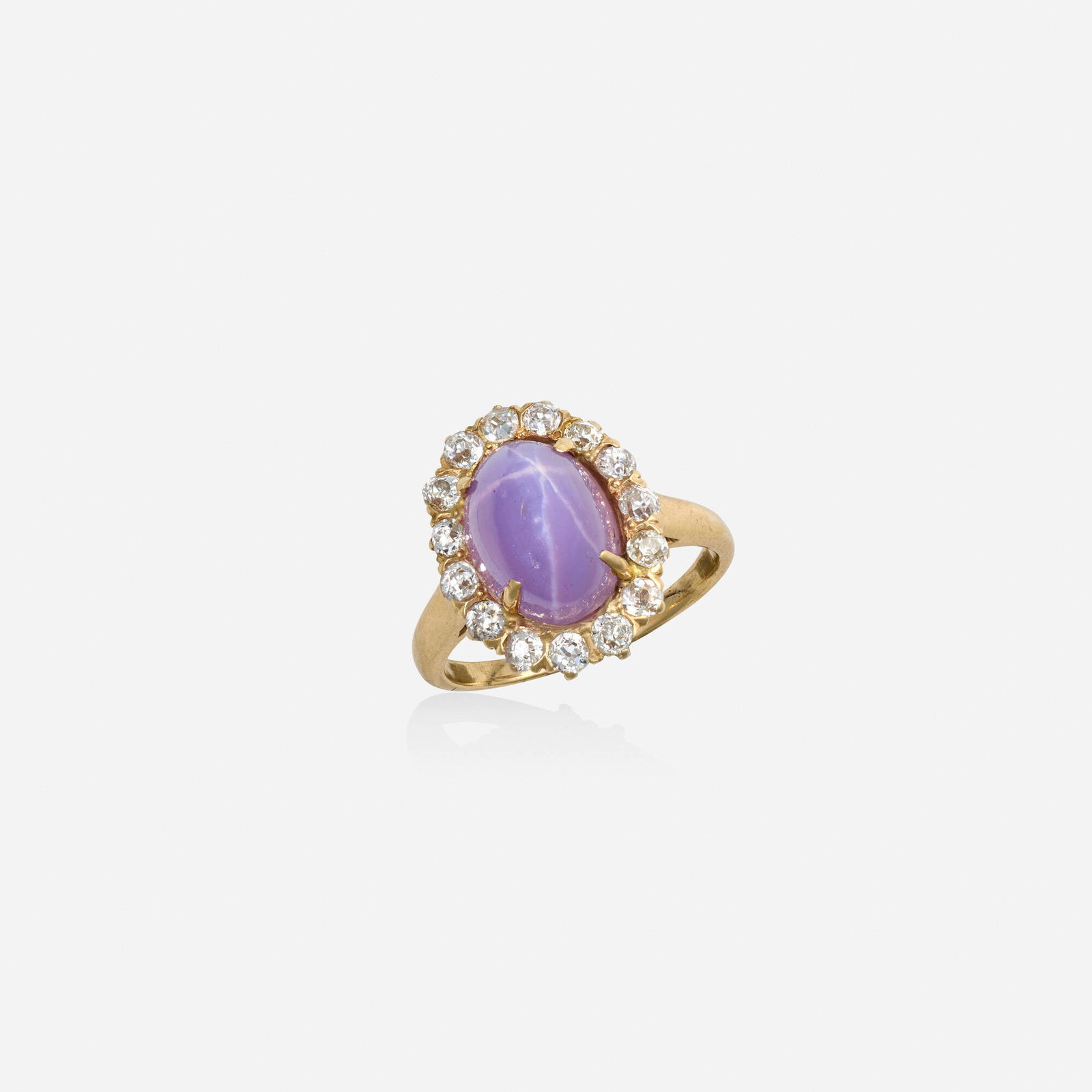 Pink star sapphire, diamond, and pink gold ring: Pink star sapphire, diamond, and pink gold ring Set with a cabochon pink star sapphire, surrounded by old mine-cut diamonds Pink gold Ring size 6; Gross weight 3.2 dwts GIA Report no. 6173795542, 09/0