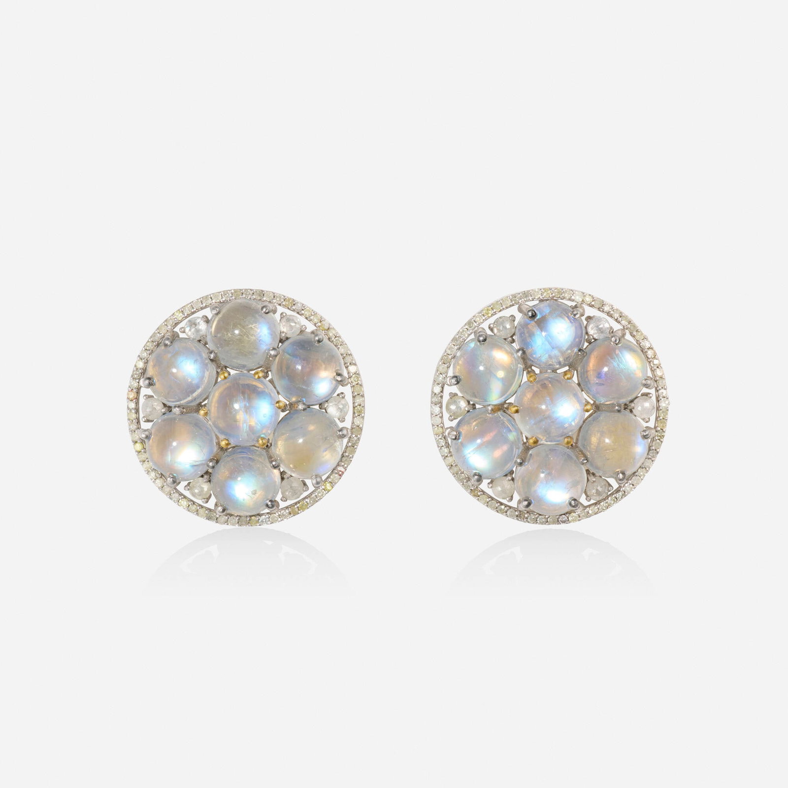 Moonstone and diamond earrings: Moonstone and diamond earrings Set with a cluster of cabochon moonstones and rose-cut diamonds Silver, yellow gold 0.875 in; Gross weight 4.1 dwts This work will ship from Lambertville, New Jersey.