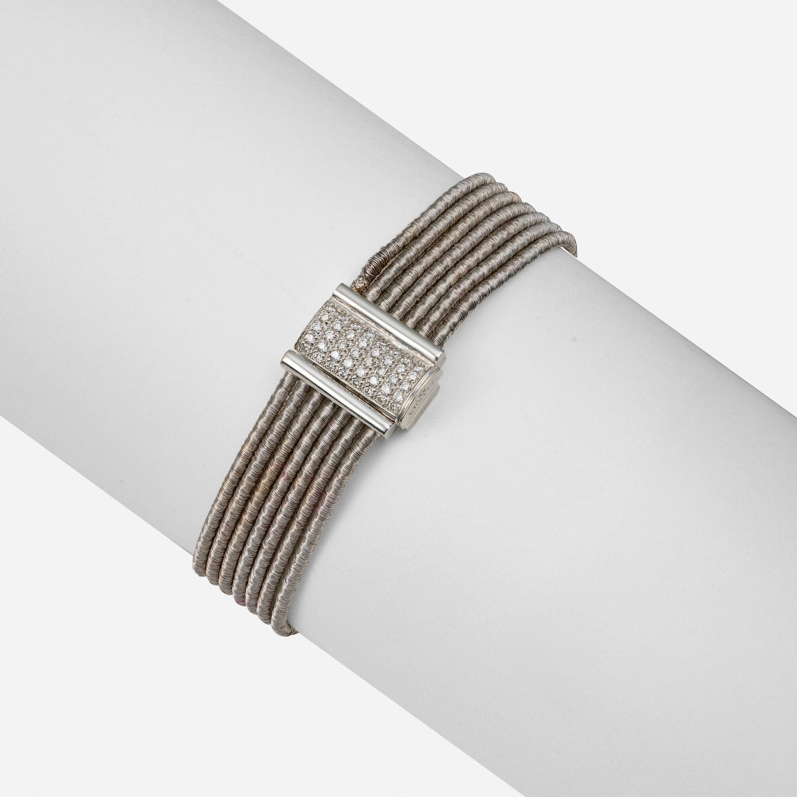 I.Reiss, 'Cocoon' diamond and white gold bracelet: I.Reiss 'Cocoon' diamond and white gold bracelet Designed with seven coiled mesh strands, the clasp pave-set with round brilliant-cut diamonds 18k white gold Signed I.Reiss 7 x 0.625 in; Gross weight
