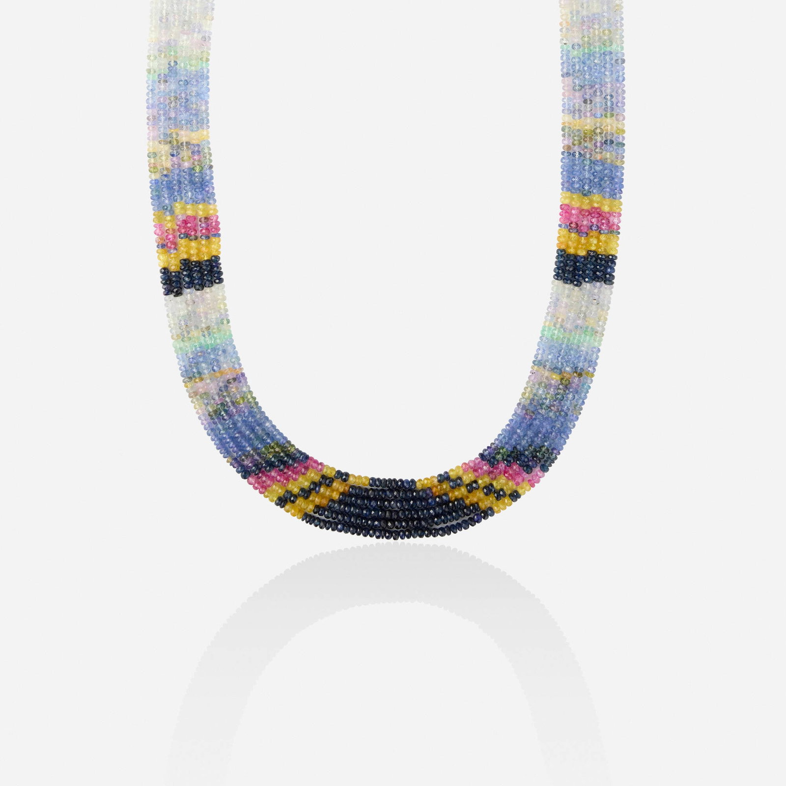 Fancy-color sapphire necklace: Fancy-color sapphire necklace Designed with strands of fancy-color sapphires, joined by a colorful cord with tassel Approx. 40 in; Gross weight 67.9 dwts This work will ship from Lambertville, New
