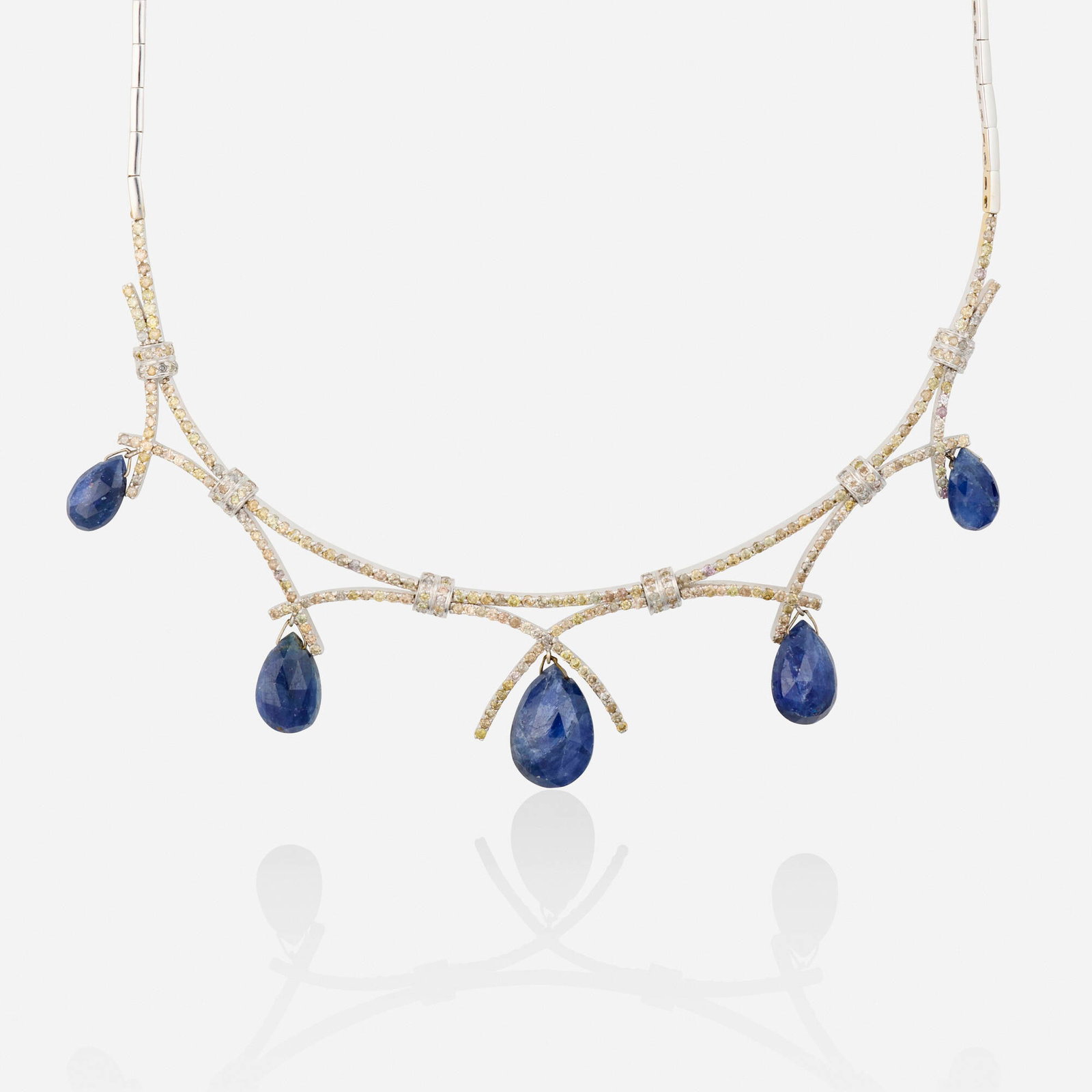 Sapphire, diamond, and white gold necklace: Sapphire, diamond, and white gold necklace Set with swags of near colorless and colored round brilliant-cut diamonds and faceted sapphire beads 18k white gold Inner circ. 16 in; Gross weight 19.2
