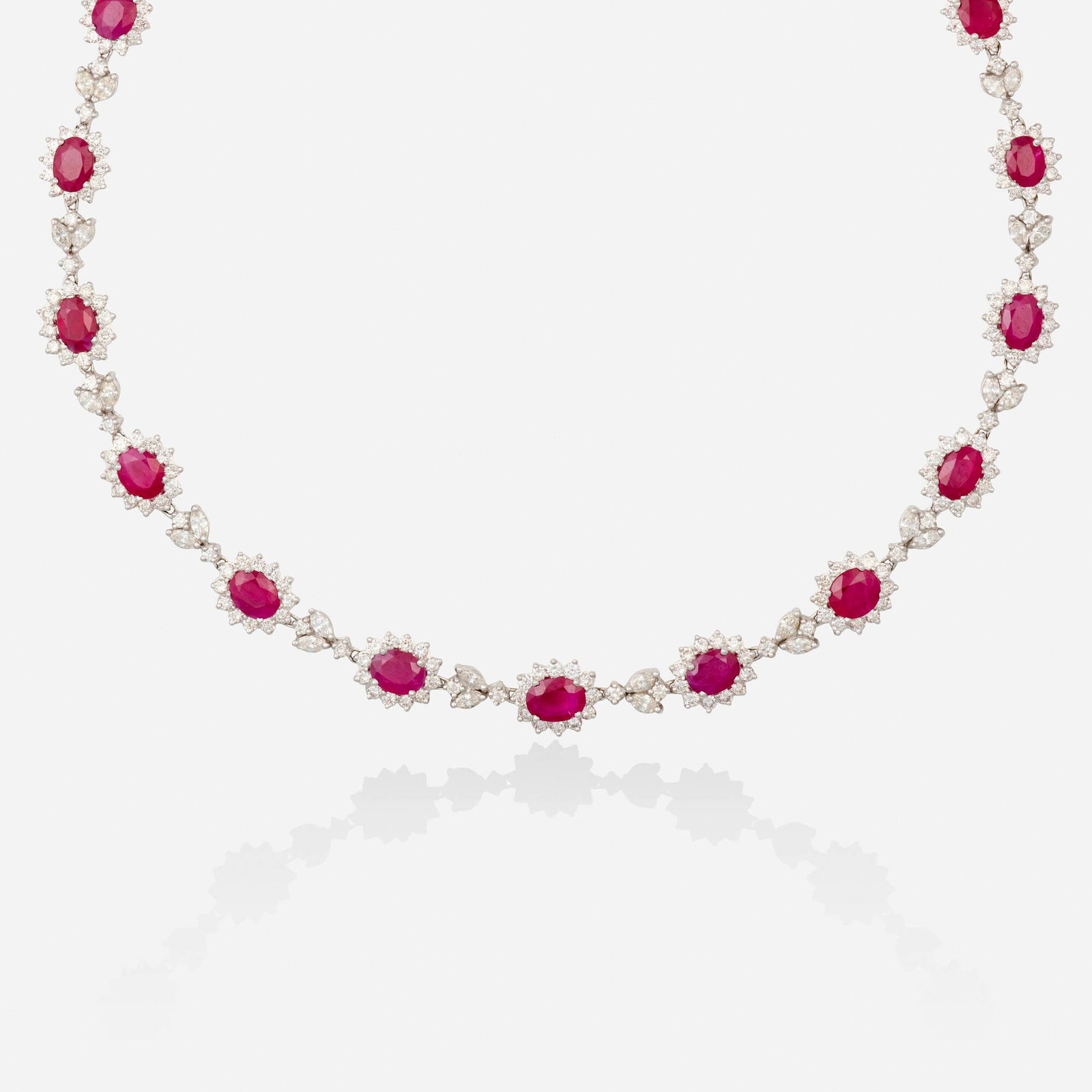 Ruby, diamond, and white necklace: Ruby, diamond, and white necklace Set with oval-cut rubies, marquise and round brilliant-cut diamonds 18k white gold 17.25 in; Gross weight 35.4 dwts This work will ship from Lambertville, New Jersey.
