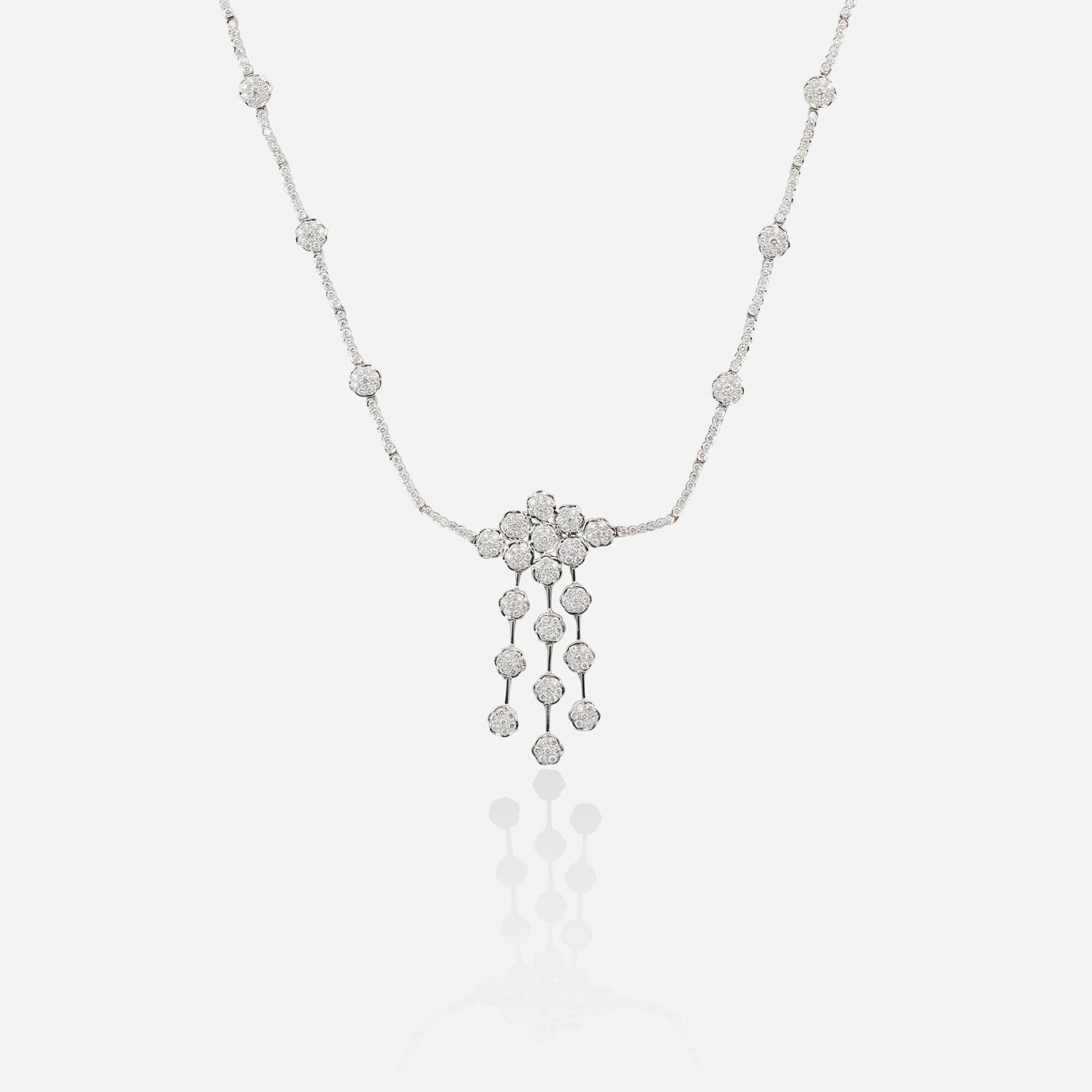 Diamond and white gold necklace: Diamond and white gold necklace Of floral design, set with round brilliant-cut diamonds 18k white gold 16.50 in; Gross weight 16.3 dwts This work will ship from Lambertville, New Jersey.