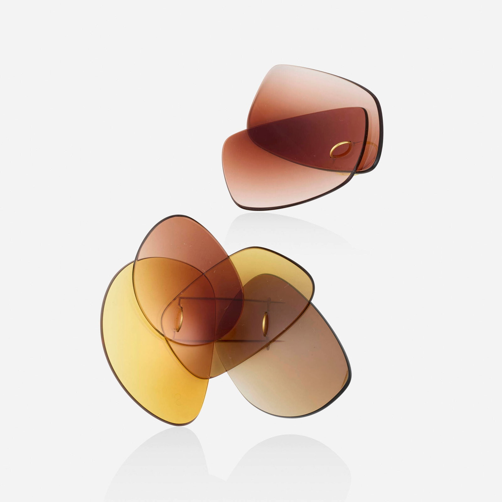 Jiro Kamata, 'Sunny' ring and brooch: Jiro Kamata 'Sunny' ring and brooch Each designed with interlocked sunglass lenses; 2005 Yellow gold Ring size 7, brooch 3.875 x 3.25 in; Gross weight 21.4 dwts Sold with a copy of Des Wahnsinns fette