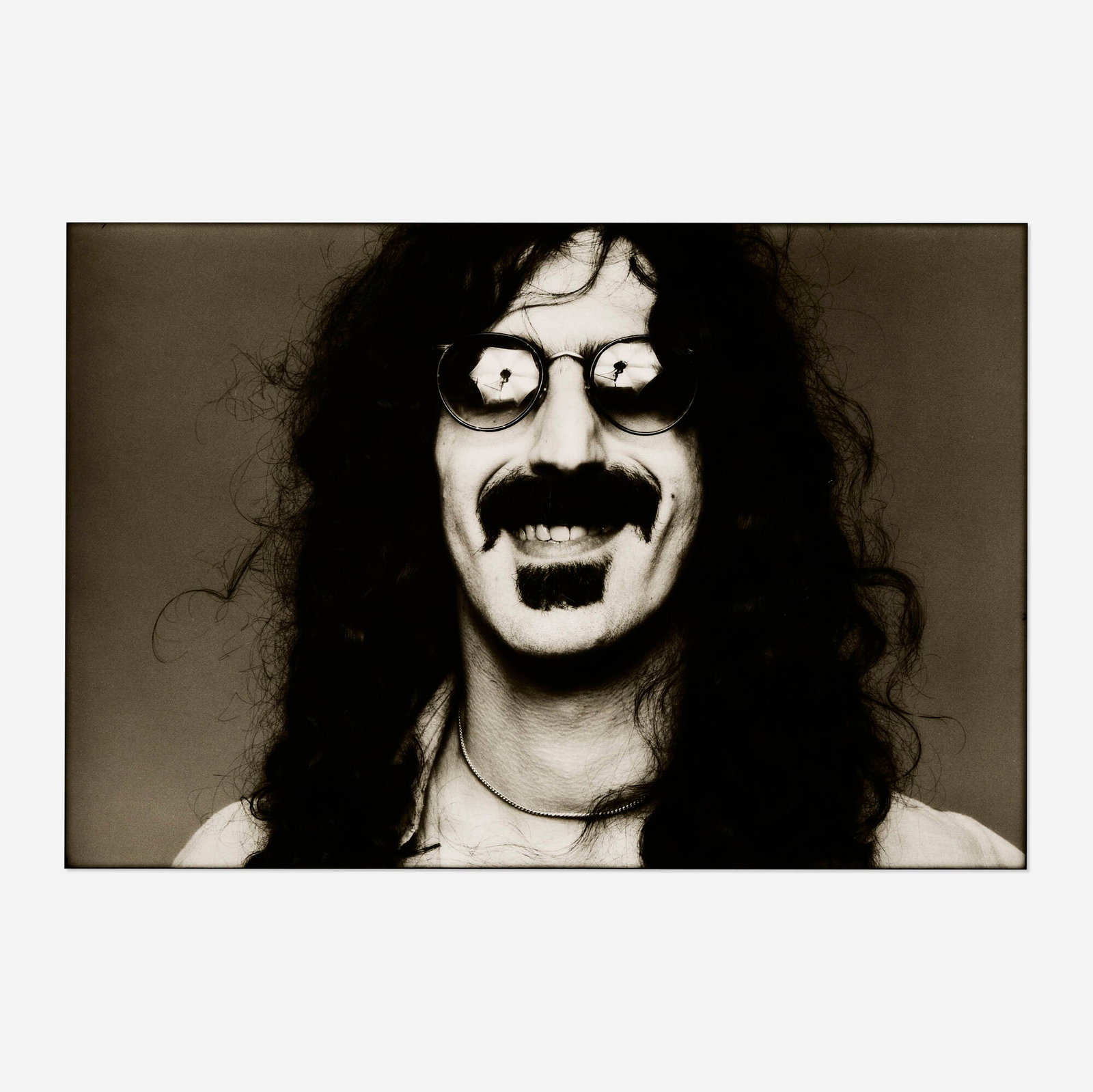 Norman Seeff, Frank Zappa: Norman Seeff Frank Zappa 1976 / printed 1981 vintage gelatin silver print image: 12.5 h x 18.75 w in (32 x 48 cm) sheet: 16 h x 19.75 w in (41 x 50 cm) Signed to verso 'Norman Seef' with