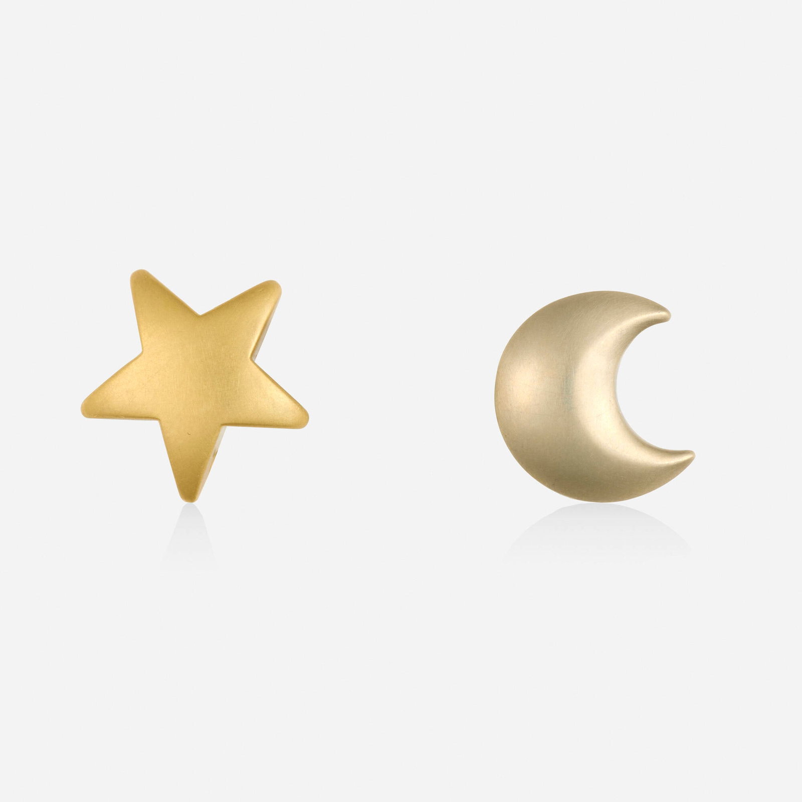 Pedro Boregaard, Bicolor gold earrings: Pedro Boregaard Bicolor gold earrings One a star, the other a crescent moon; 1990 18k yellow and white gold Signed Boregaard 0.75 x 0.75 in; Gross weight 10.2 dwts This work wi