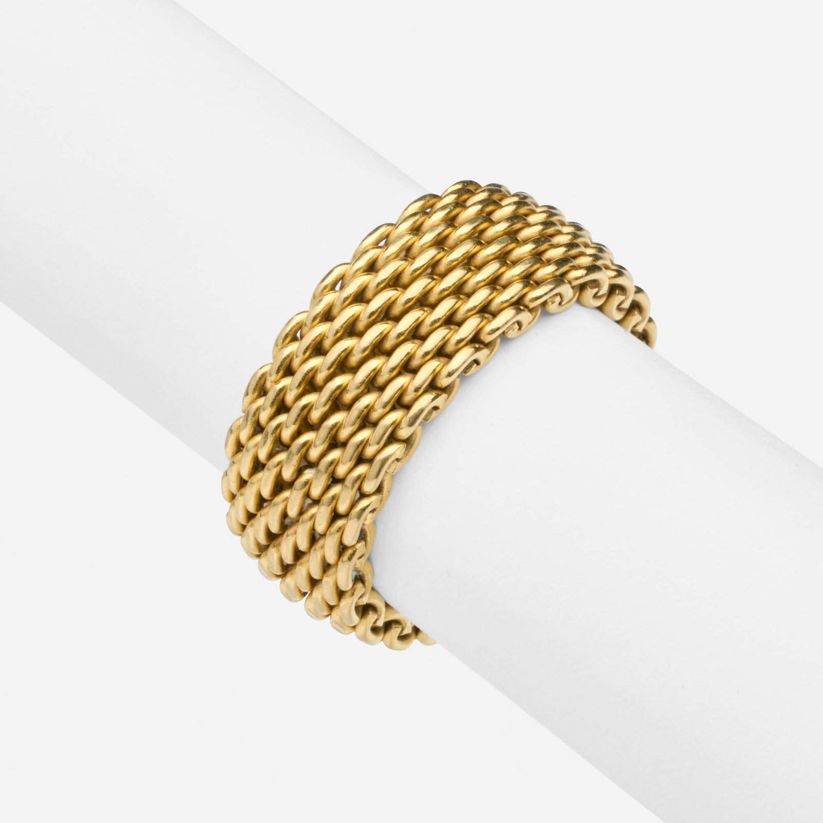 Tiffany & Co., 'Somerset' gold ring: Tiffany & Co. 'Somerset' gold ring Of woven mesh 18k yellow gold Signed T&Co. Ring size 9; Gross weight 9.1 dwts Sold with signed pouch This work will ship from Lambertville