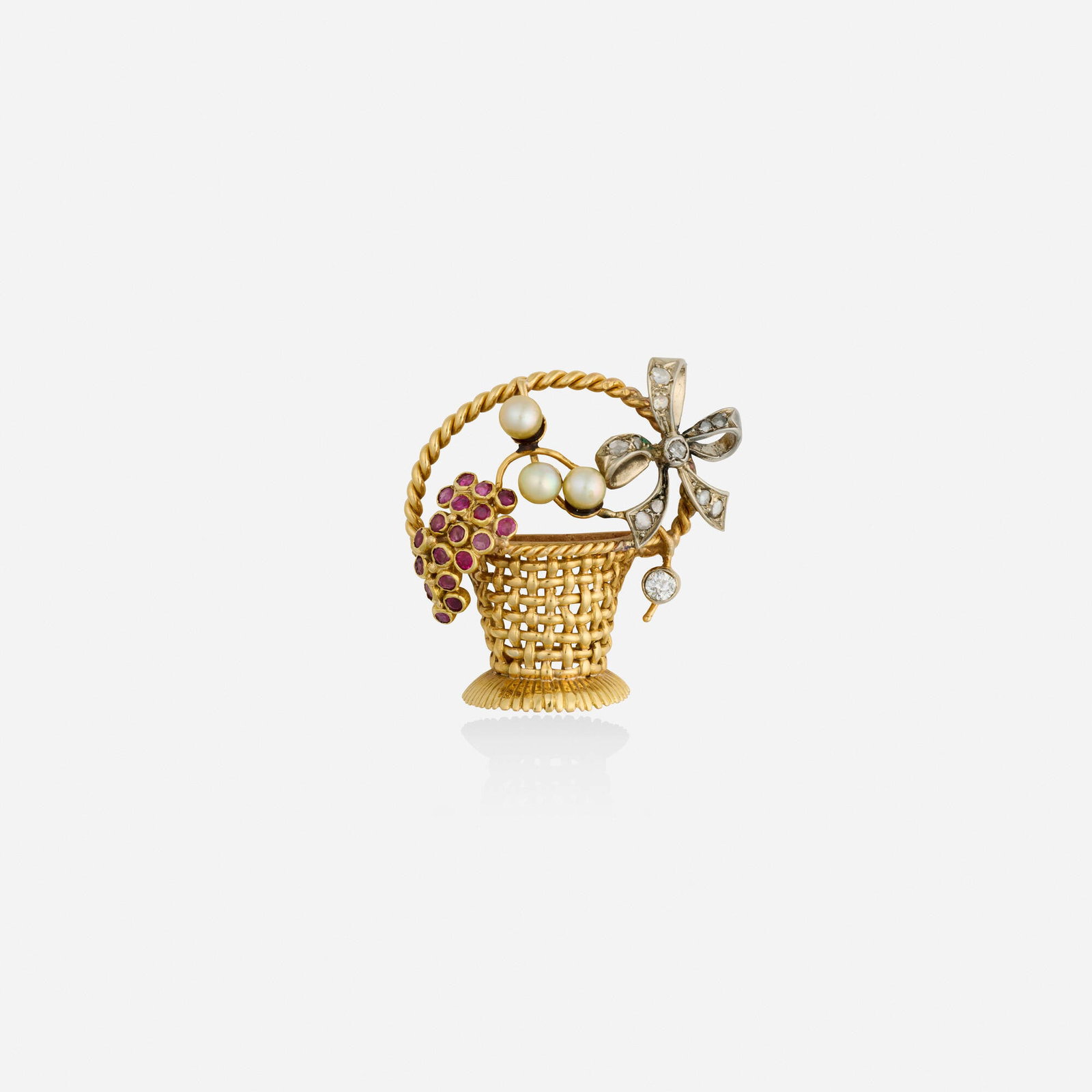 Portuguese, Ruby, cultured pearl, and diamond brooch: Portuguese Ruby, cultured pearl, and diamond brooch The basket set with circular-cut rubies, cultured pearls, rose and old mine-cut diamonds 19k yellow gold and silver 1.25 x 1.25 in; Gross weight 5.6