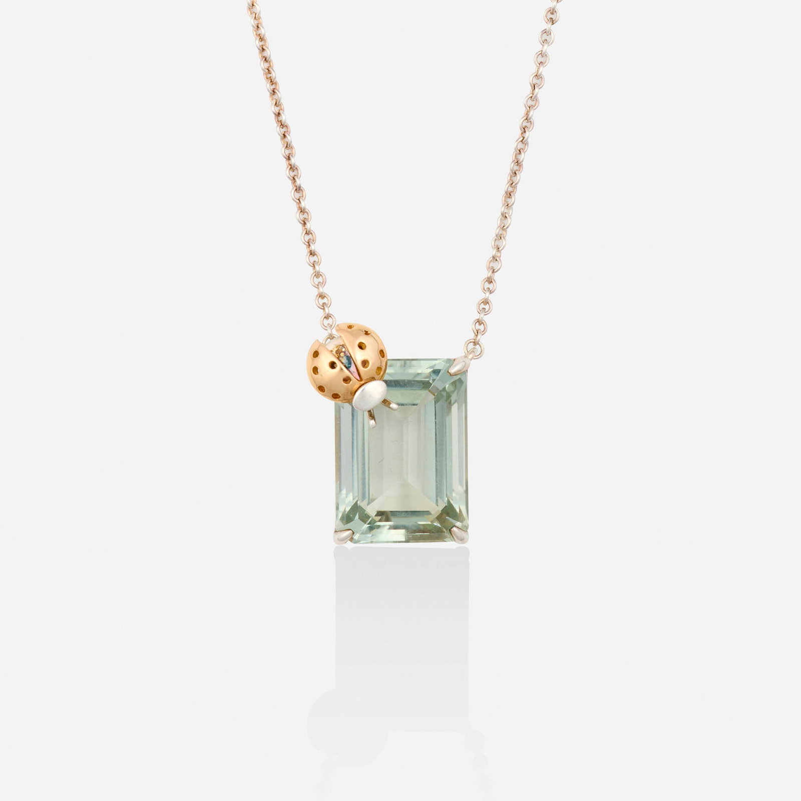 Tiffany & Co., 'Return to Tiffany Love Bugs' green quartz, sterling silver, and pink gold necklace: Tiffany & Co. 'Return to Tiffany Love Bugs' green quartz, sterling silver, and pink gold necklace The pendant designed with a ladybug and emerald-cut green quartz, suspended from the fine link chain S