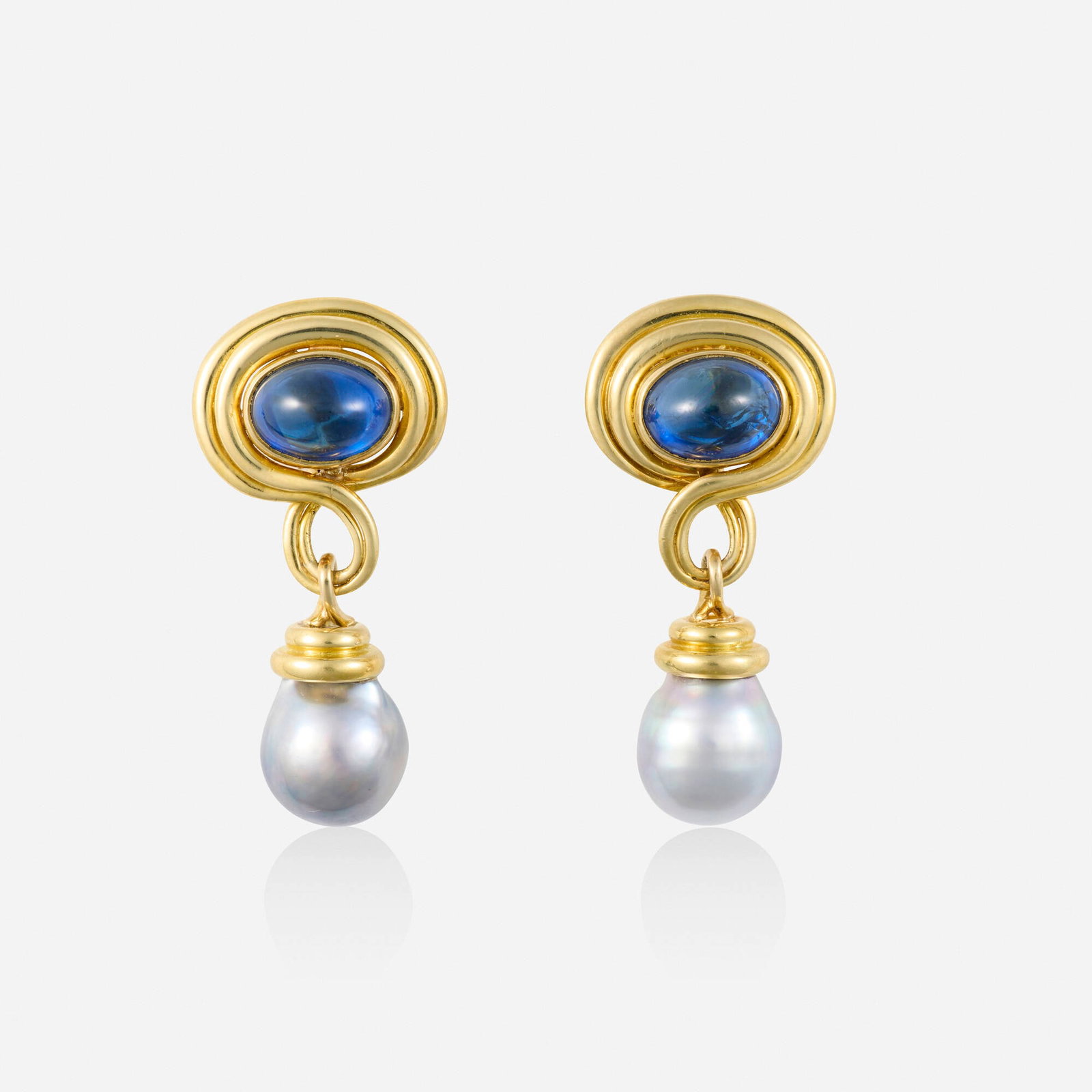 Carimati, Sapphire, baroque cultured pearl, and gold earrings: Carimati Sapphire, baroque cultured pearl, and gold earrings Each set with a cabochon sapphire framed by gold, suspending a grey baroque cultured pearl 18k yellow gold Signed Caramati 1.50 x 0.625