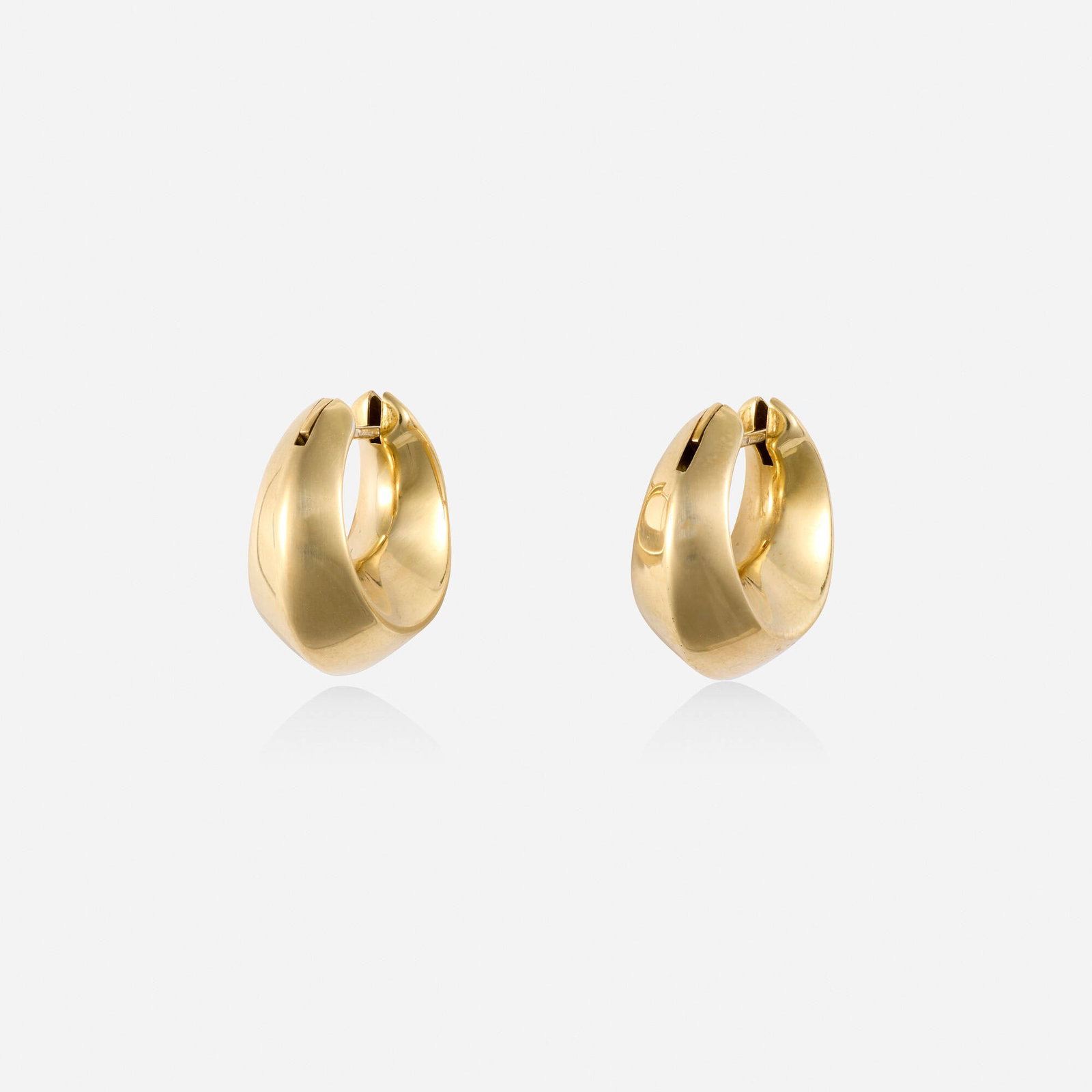 Italian, Gold earrings: Italian Gold earrings Each designed as a gold hoop 18k yellow gold 0.75 x 0.375 in; Gross weight 3.2 dwts This work will ship from Lambertville, New Jersey.