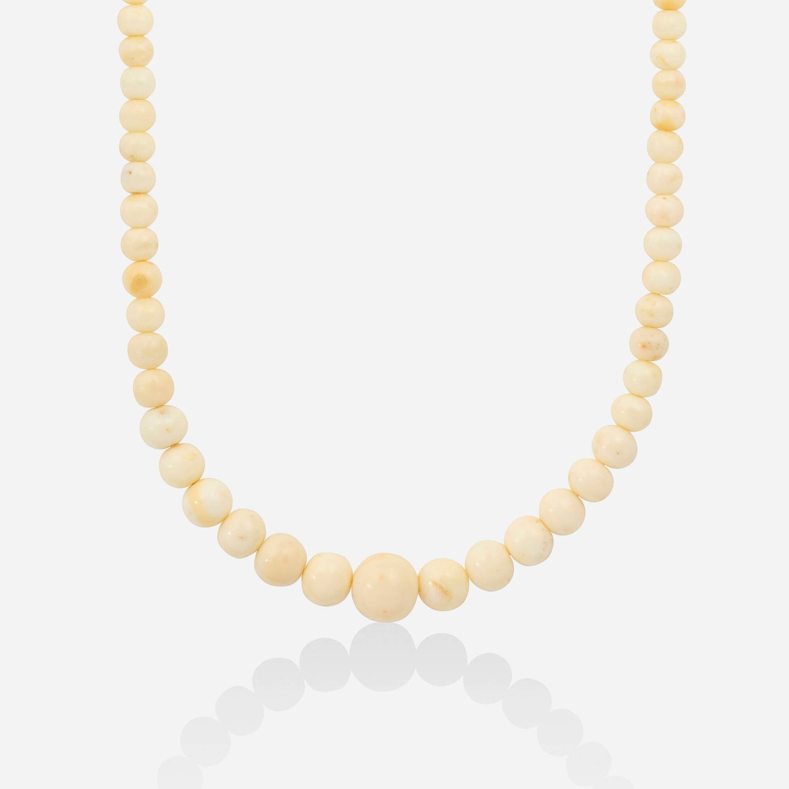 Italian, Coral and gold necklace: Italian Coral and gold necklace Strung with graduated coral beads 18k yellow and white gold 28.50 in; Gross weight 65.4 dwts This work will ship from Lambertville, New Jersey.