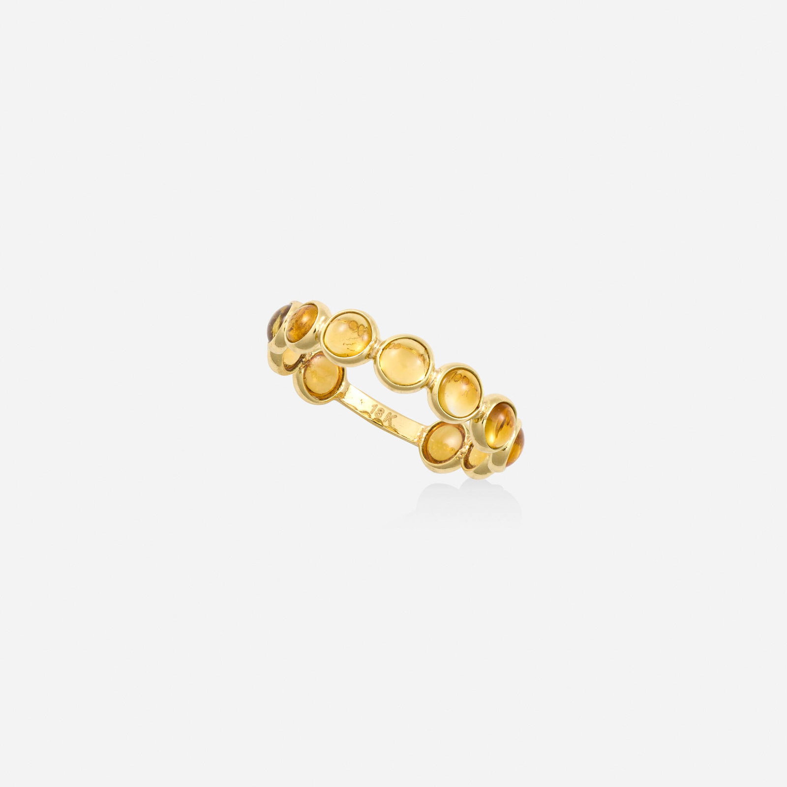 Citrine and gold ring: Citrine and gold ring Bezel-set with cabochon citrines 18k yellow gold Ring size 7; Gross weight 0.9 dwts This work will ship from Lambertville, New Jersey.