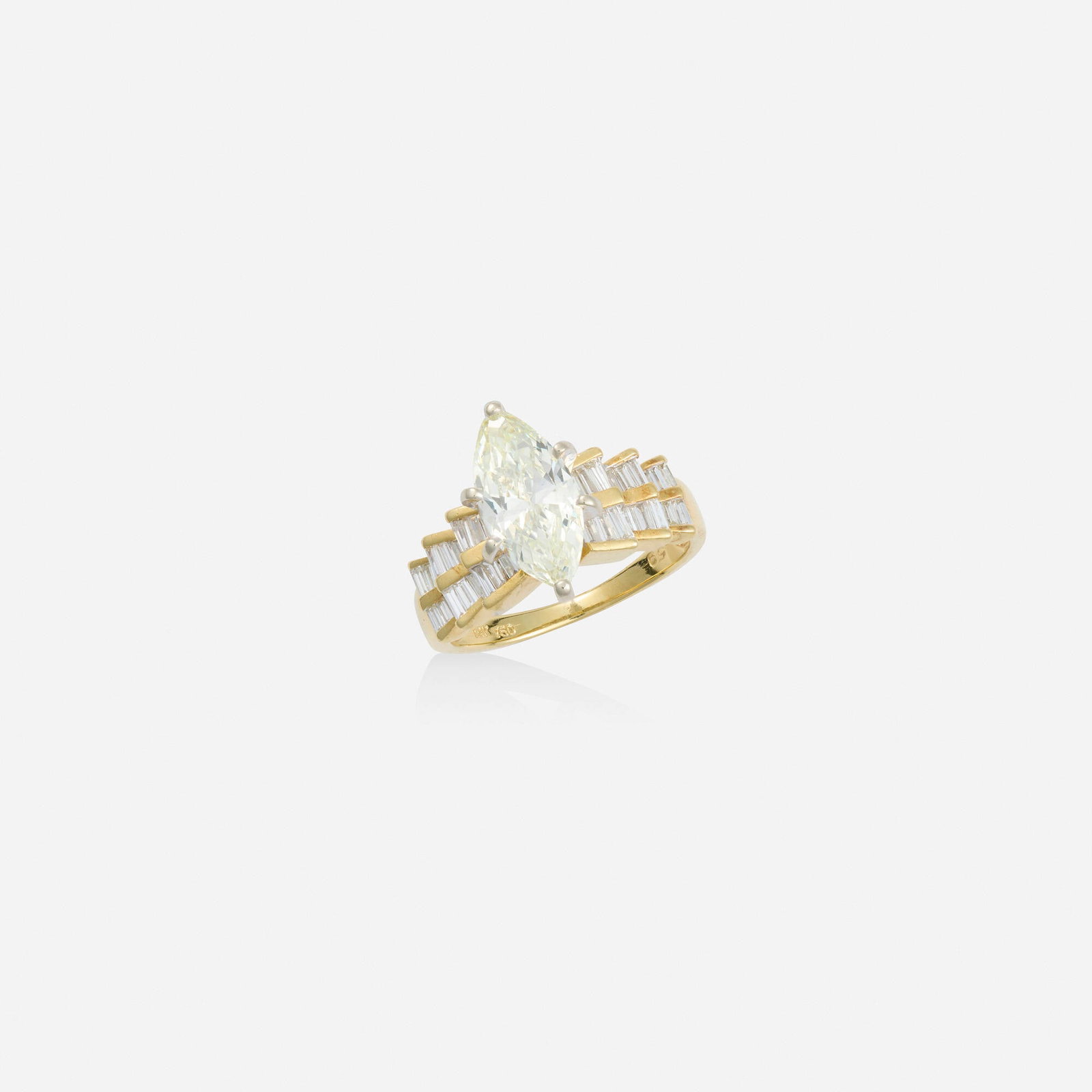 Diamond and gold engagement ring: Diamond and gold engagement ring Set with a marquise-cut diamond, flanked by baguette-cut diamonds 18k yellow and white gold Ring size 6; Gross weight 3.4 dwts This work will ship from Lambertville, N