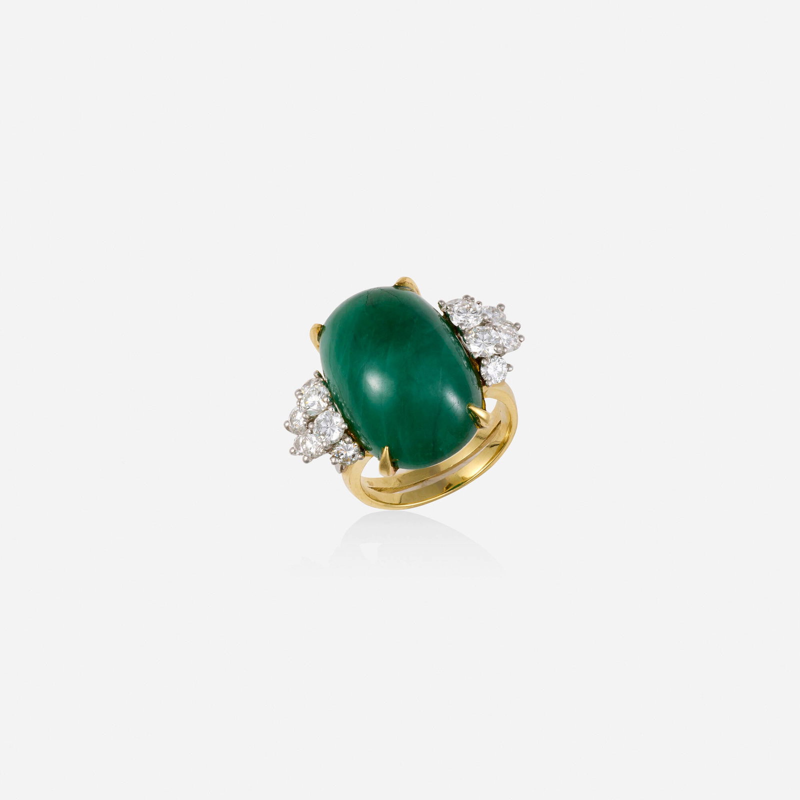 Emerald, diamond, and gold ring: Emerald, diamond, and gold ring Set with a cabochon emerald, flanked by round brilliant-cut diamonds Yellow gold, platinum Ring size 5.75-6; Gross weight 7.9 dwts This work will ship from Lambertville